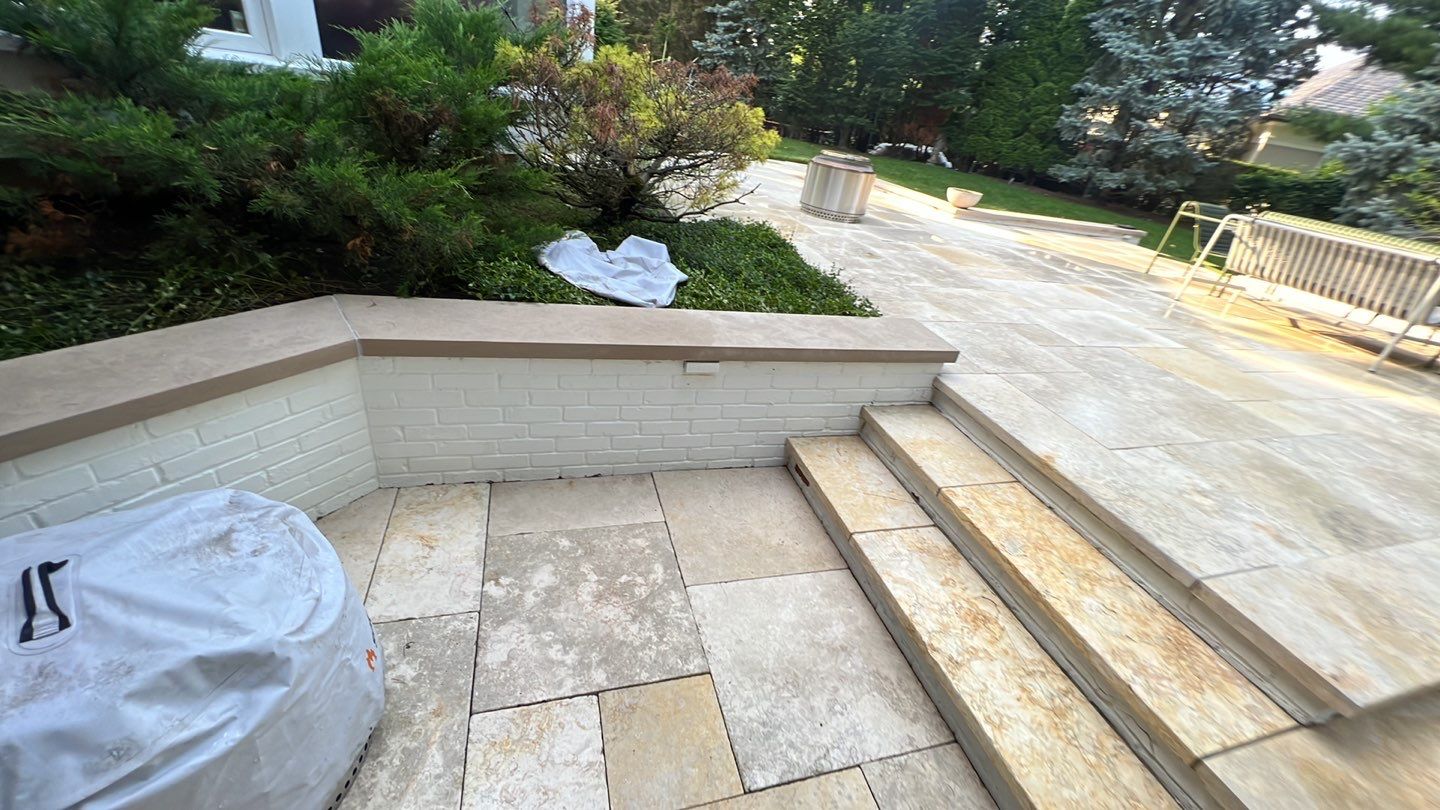 marble patio cleaning and sanding using Polysweep polymeric sand by Northern Power Washing LLC.
