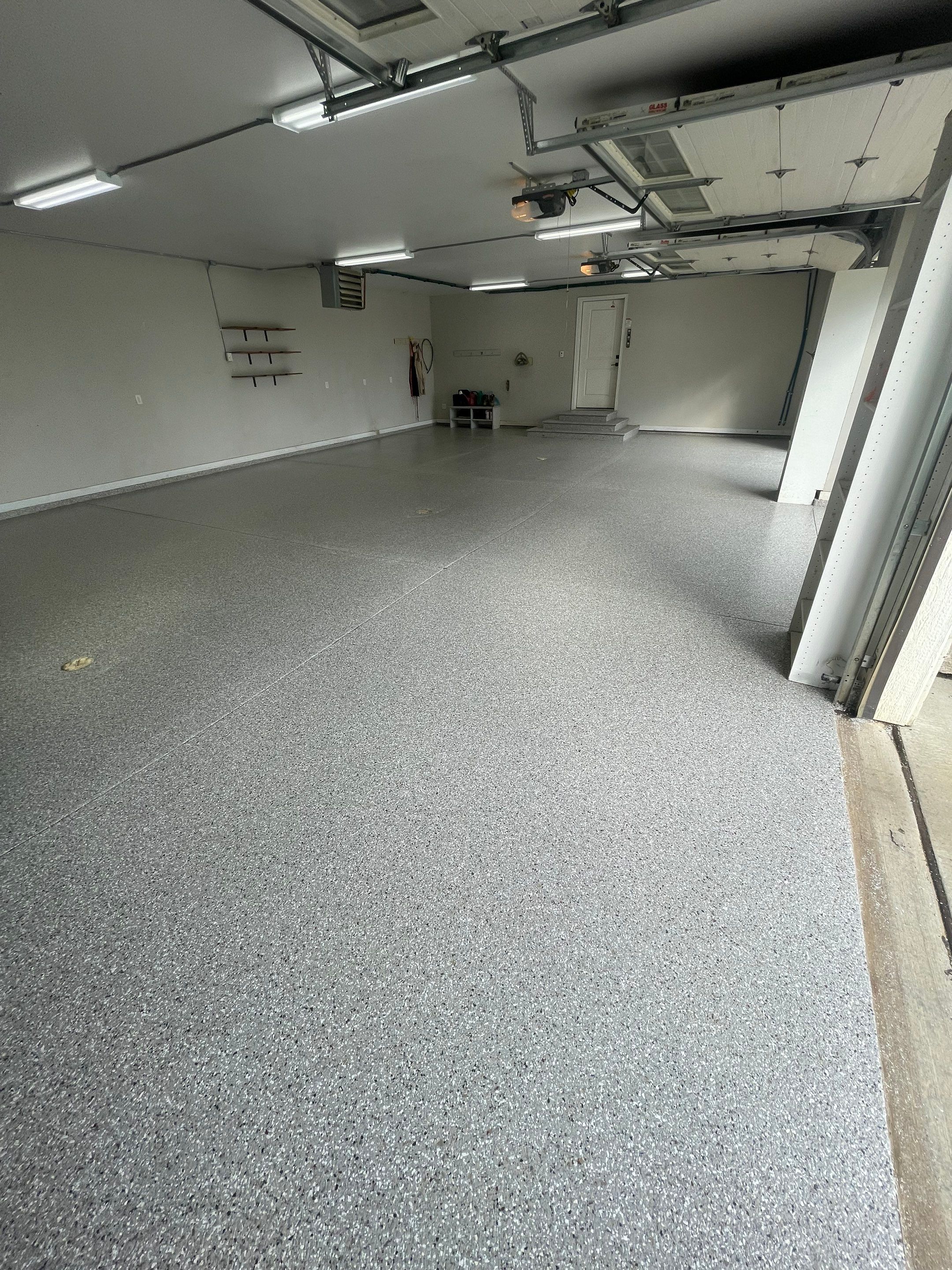 Grey Speckled Polyuera Garage Floor Coating for Hartford Three-Car Garage by Select Painting, Coatings & Garage Cabinets