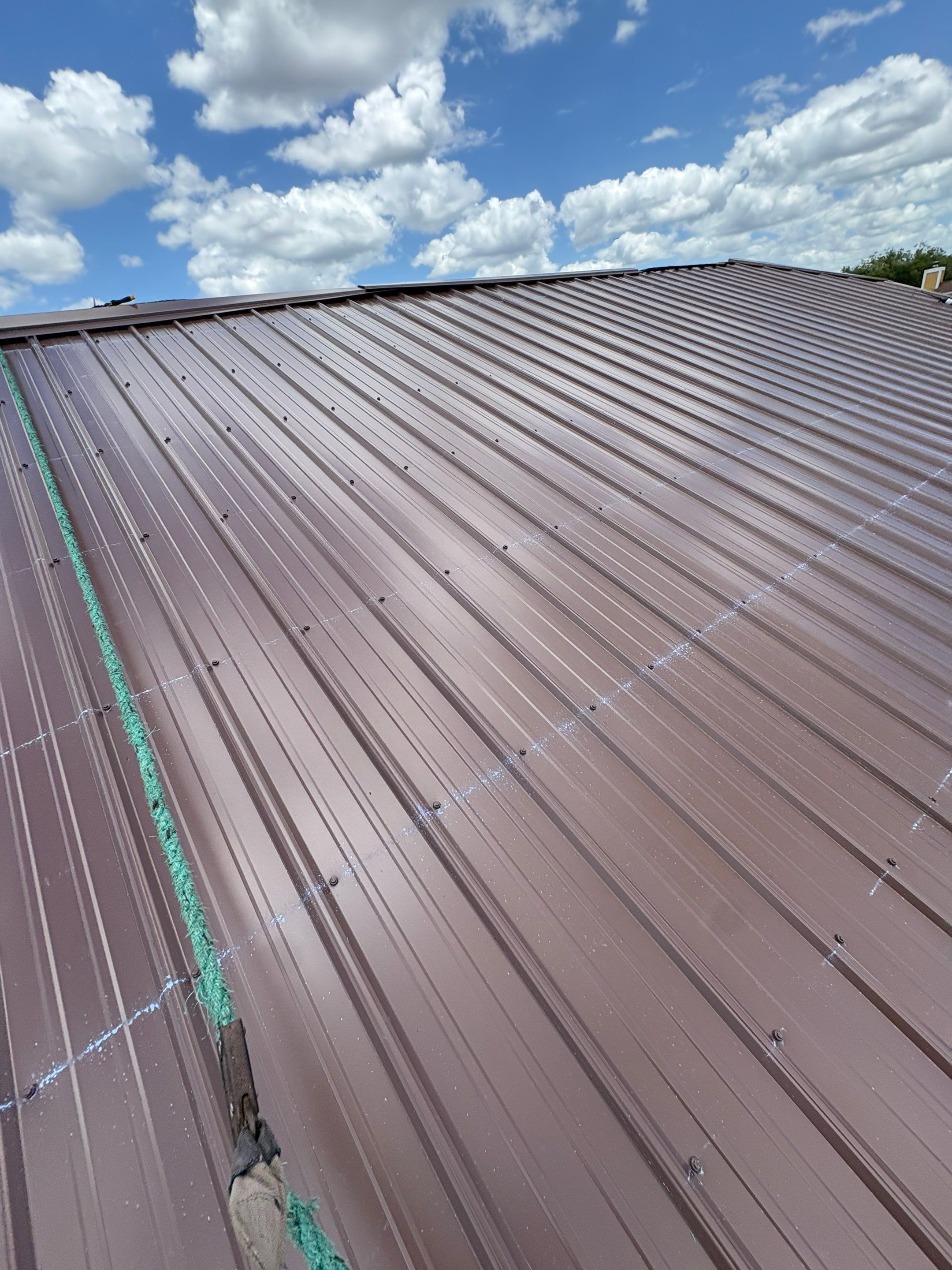 Residential Metal Roofing Installation and Gutter Replacement in Kissimmee by Pinnacle Roofing Group