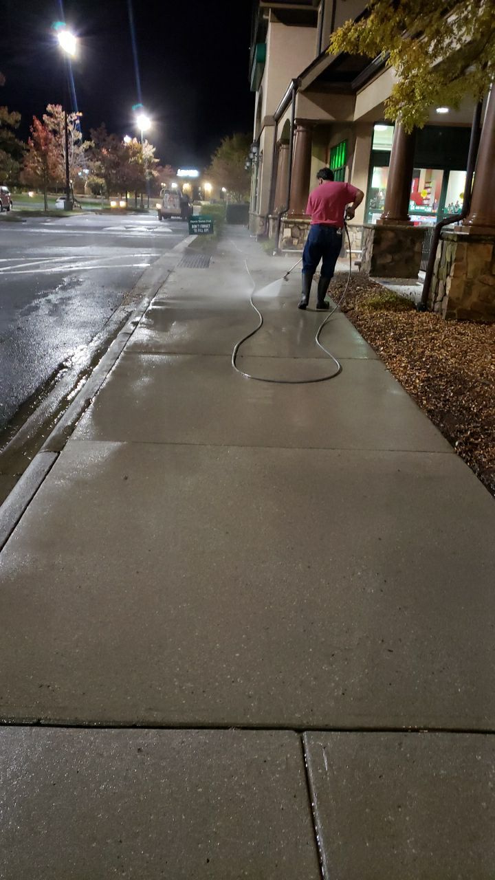 contrete cleaning using cleaner by Power Wash Masters LLC