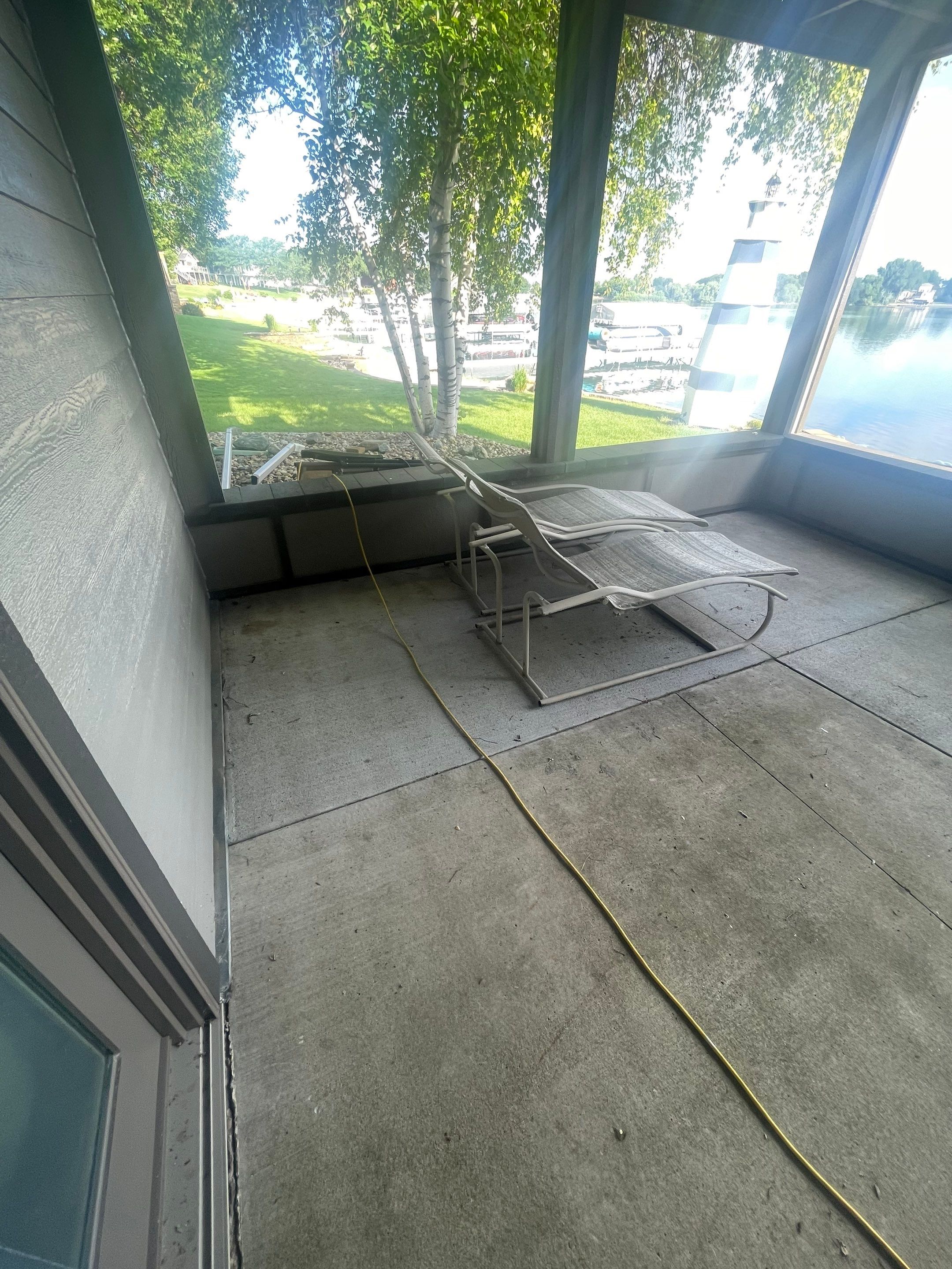 Lakefront Screened Patio Concrete Coating Installation in Wentworth by Select Painting, Coatings & Garage Cabinets