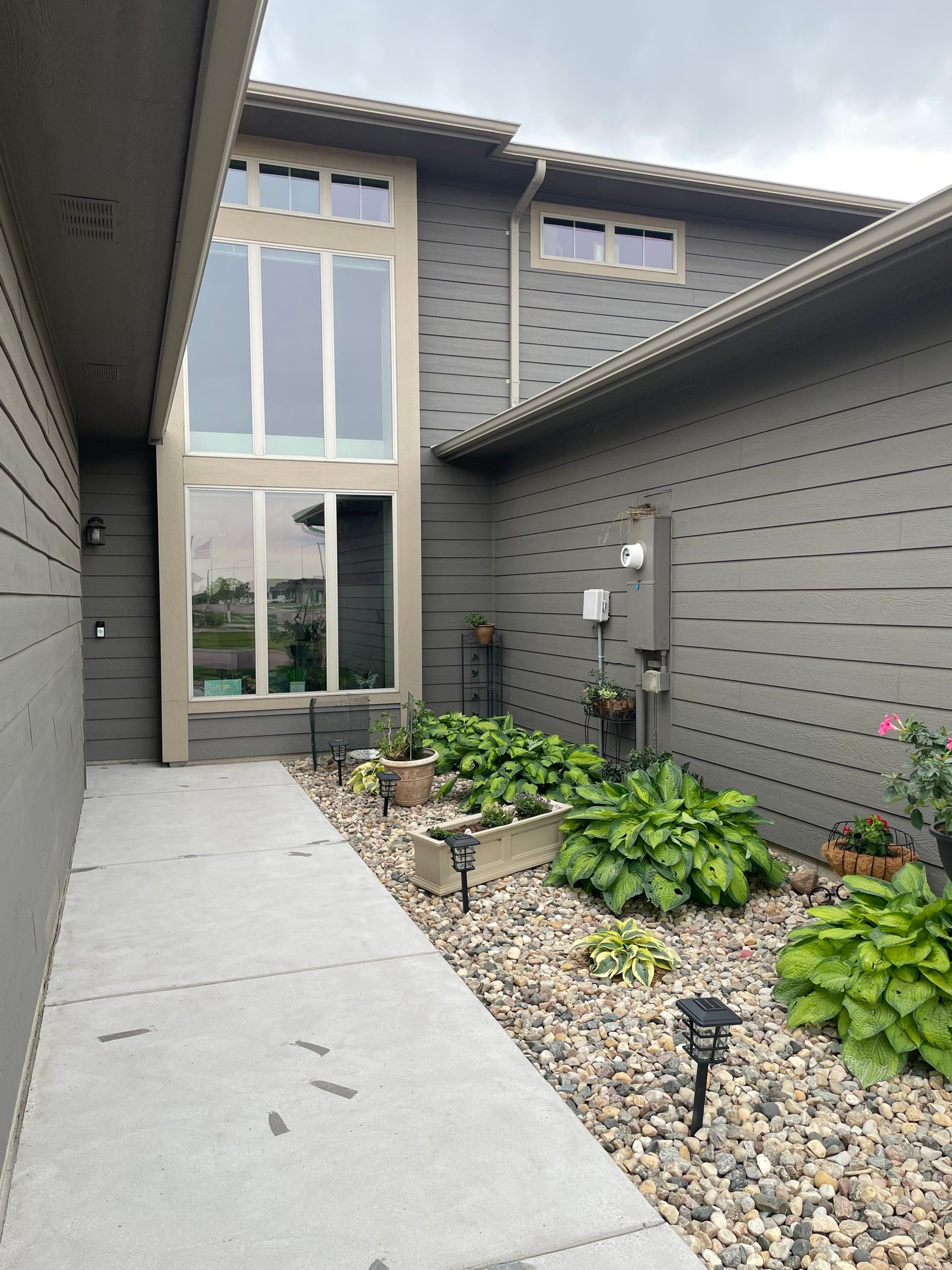 Custom Concrete Coating for Sioux Falls Patio and Front Walkway by Select Painting, Coatings & Garage Cabinets