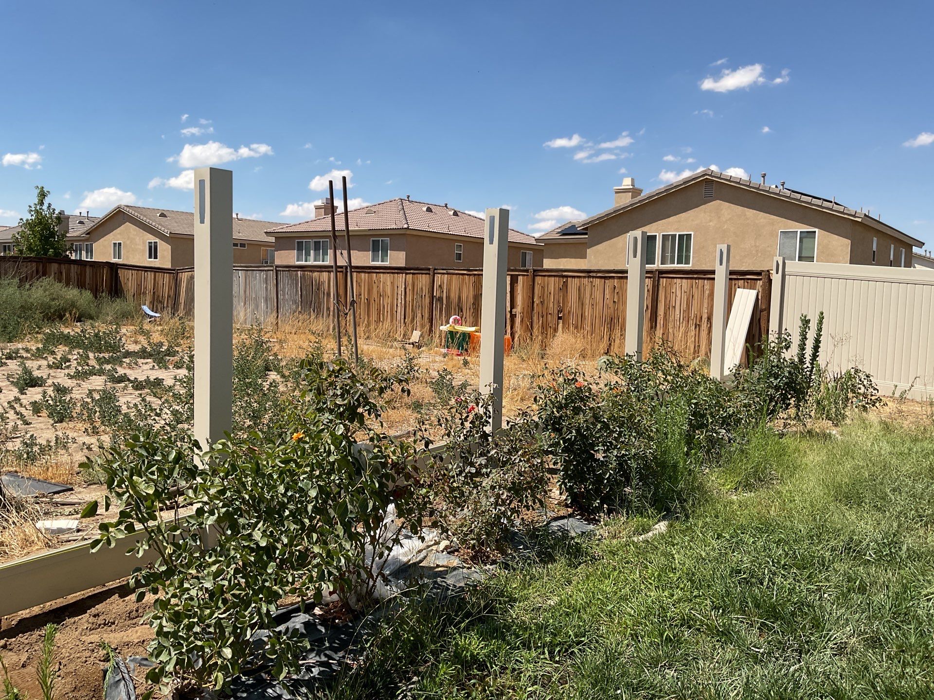 Tan Vinyl by Fence Guys Inc. 