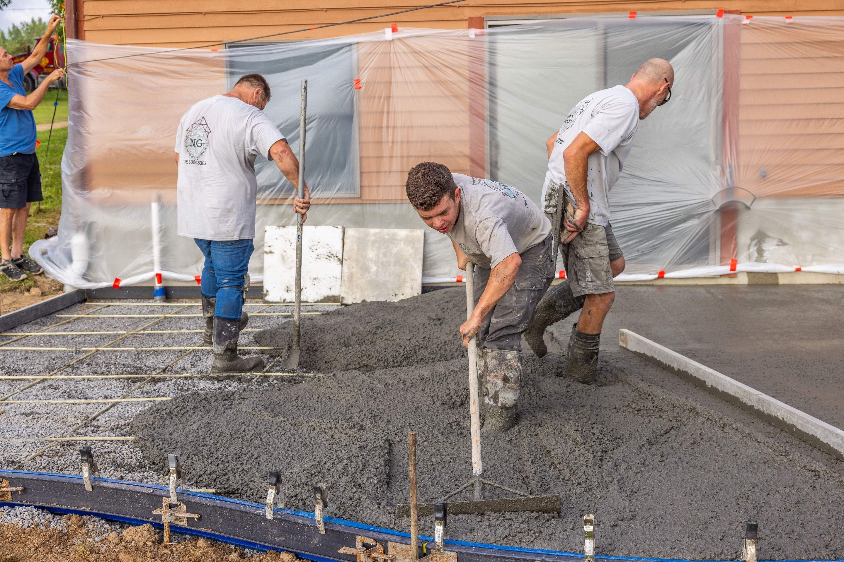 Bluestone textured concrete stamped patio  by NG Masonry & Construction LLC