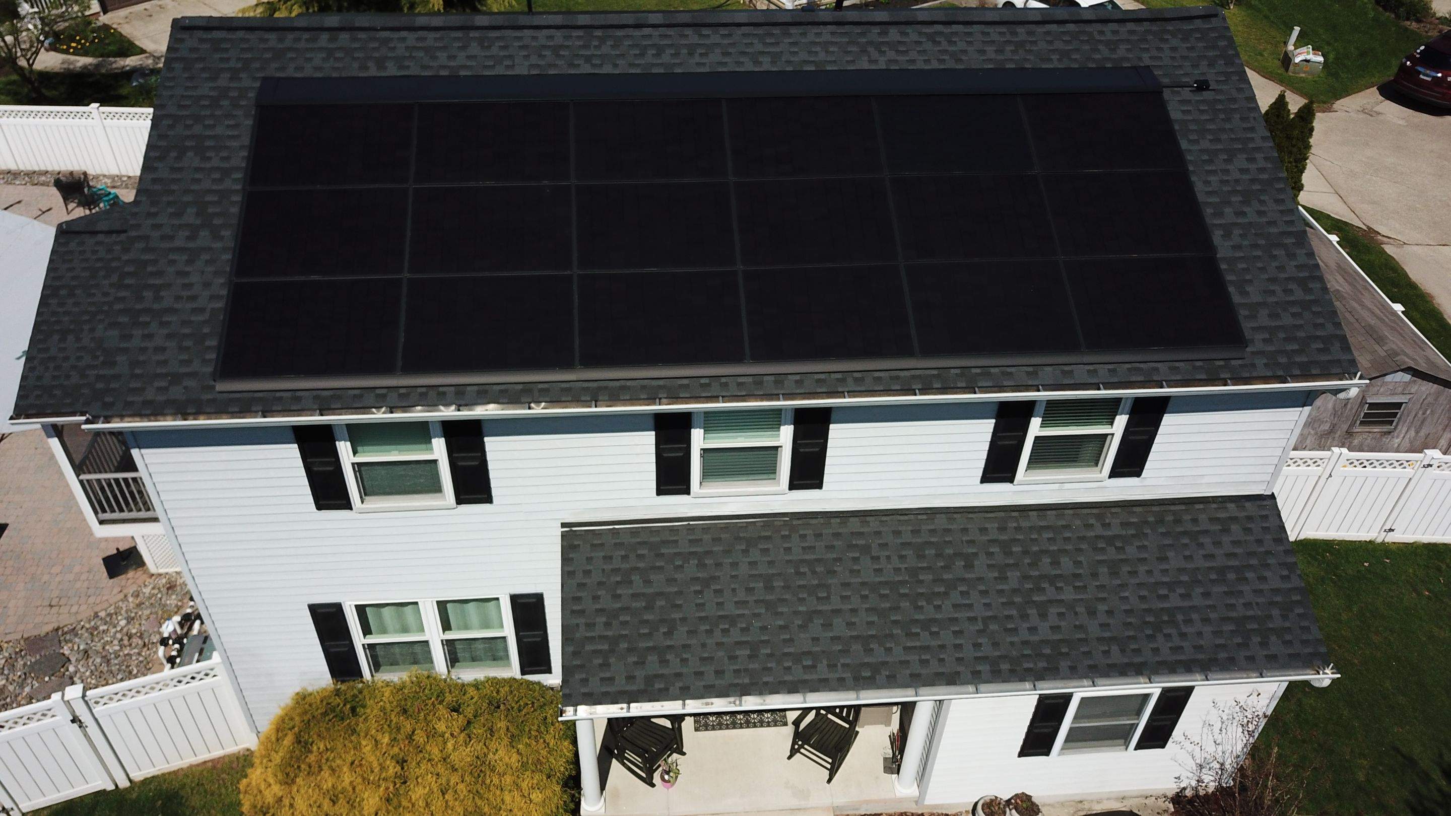 Roof Replacement with GAF Decotech integrated solar panels by American Home Contractors