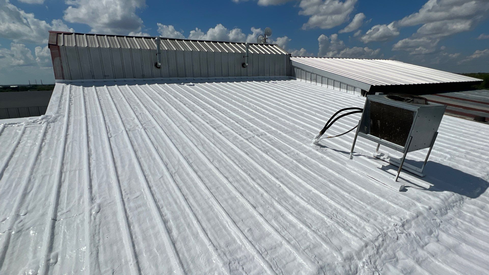 Commercial Roofing Repair using TRP #924 Eterna-Sil Premium Silicone Roof Coating by Harvey Roofing & Construction