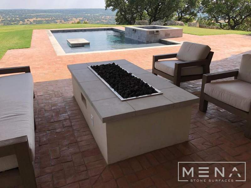 Kitchen, outdoor kitchen and pool brick floor installation by Mena stone surfaces