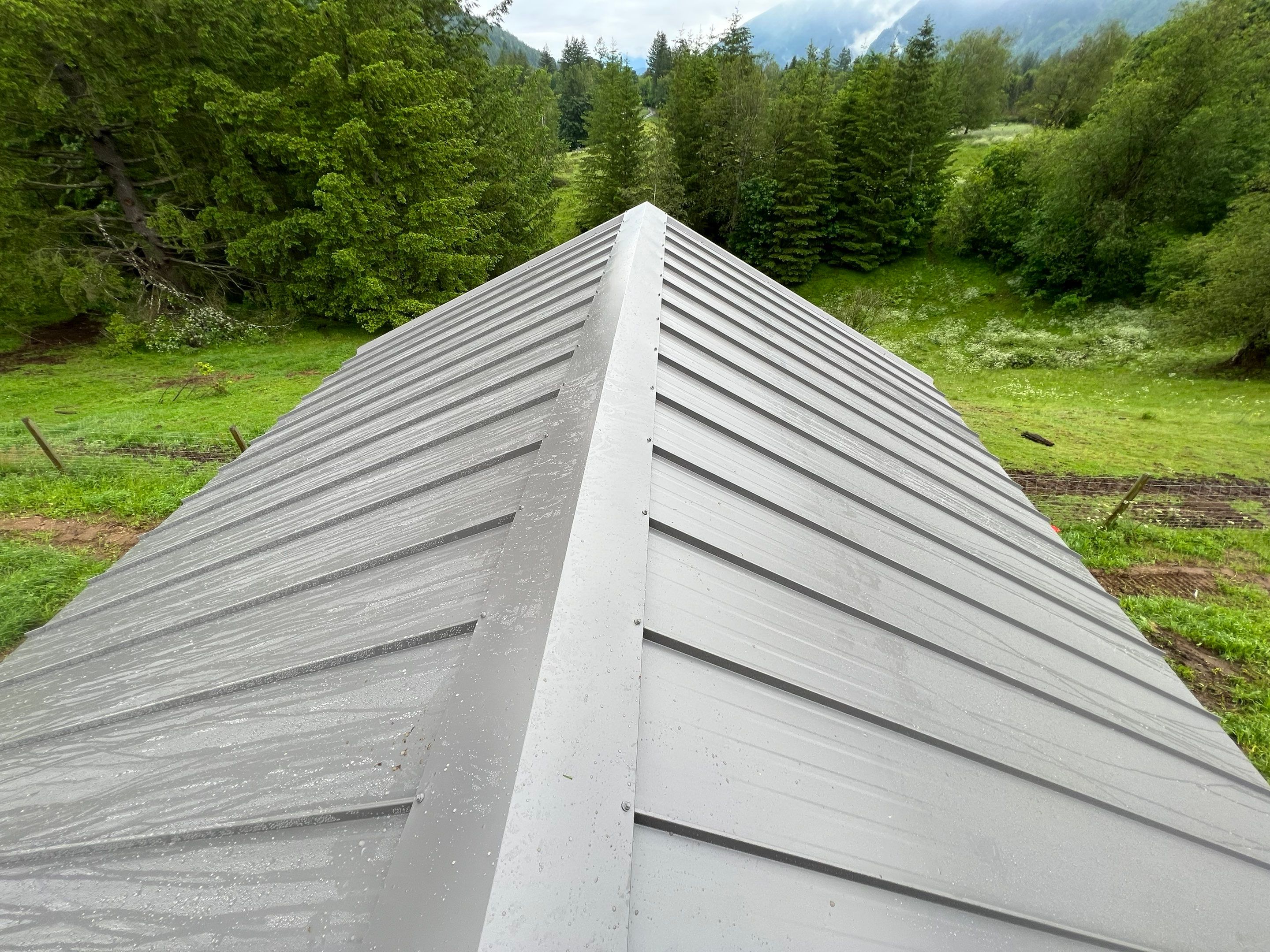 Commercial Roofing Installation using corrugated metal by Top Notch Roofing Inc