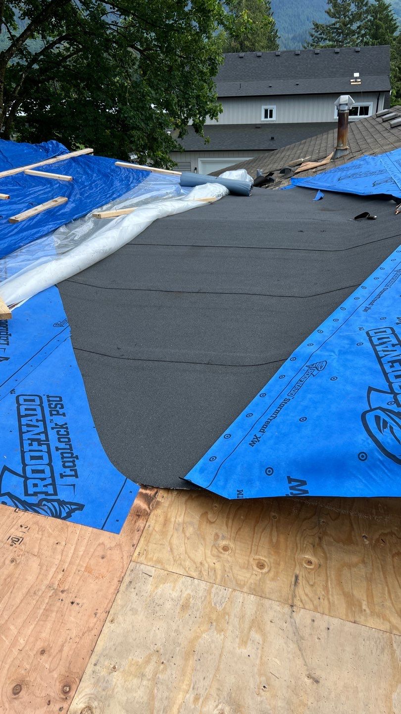 Residential Roofing Installation using 12" Prolok metal, shingles and Torch on roofing by Top Notch Roofing Inc