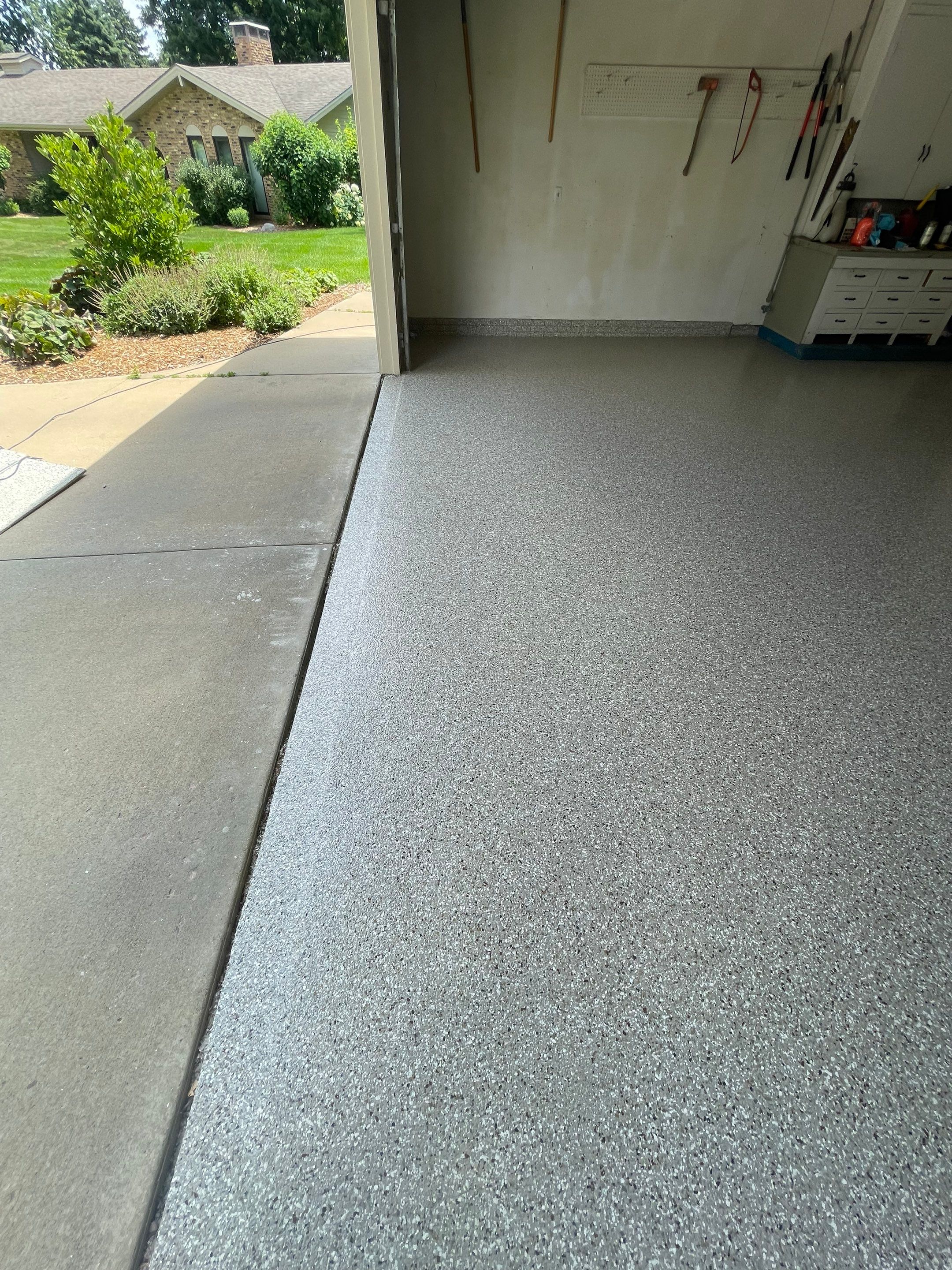 Custom Creekbed Garage Floor Coating in Sioux Falls by Select Painting, Coatings & Garage Cabinets