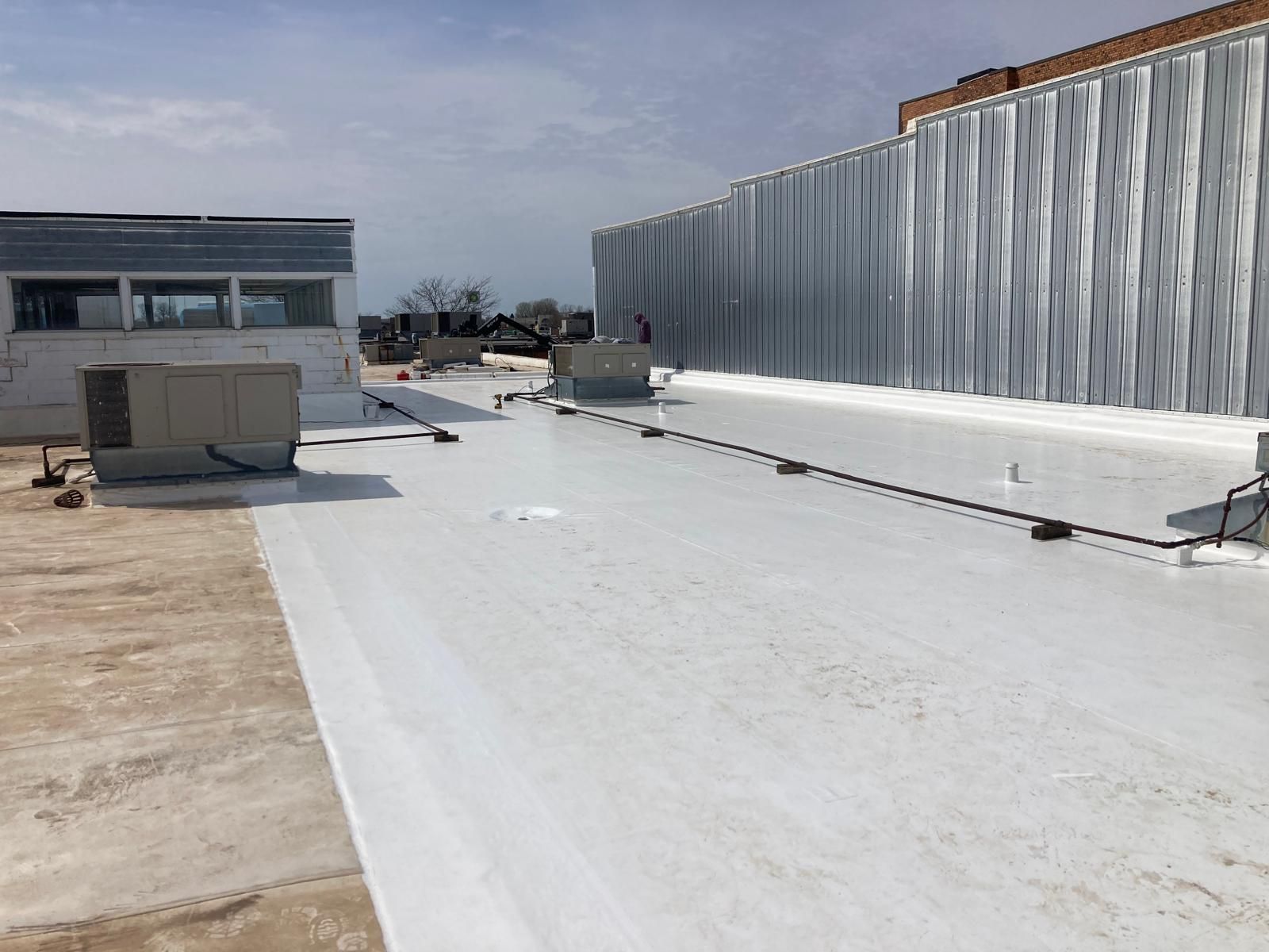 Full Roof Tear-off with new Code ISO insulation and 50 Mil Membrane by Grell Roofing, LLC
