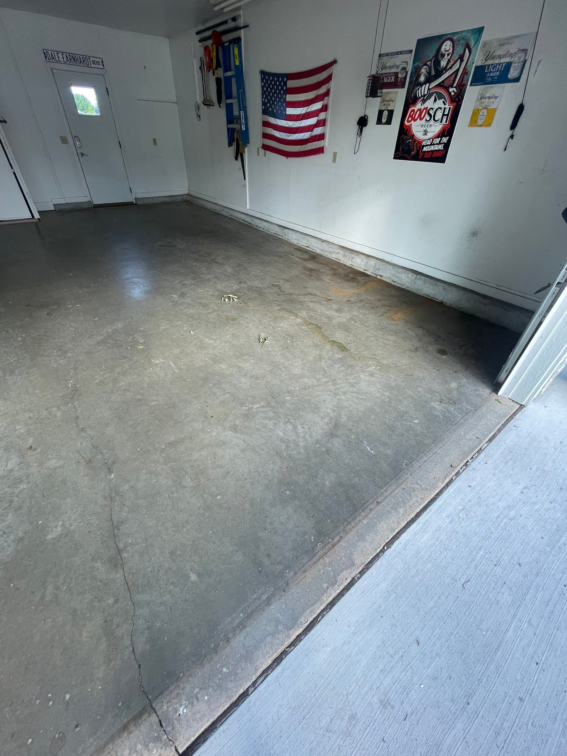 Residential Garage Floor Coating with Feather Grey Finish in Sioux Falls by Select Painting, Coatings & Garage Cabinets