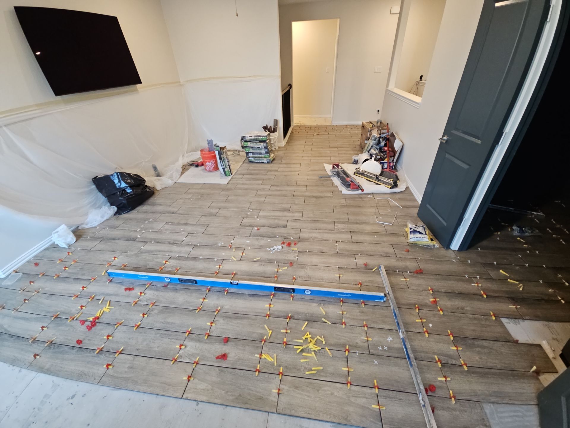 Carpet replacement with Tile and Red Oak Stairs by EL-GC LLC 