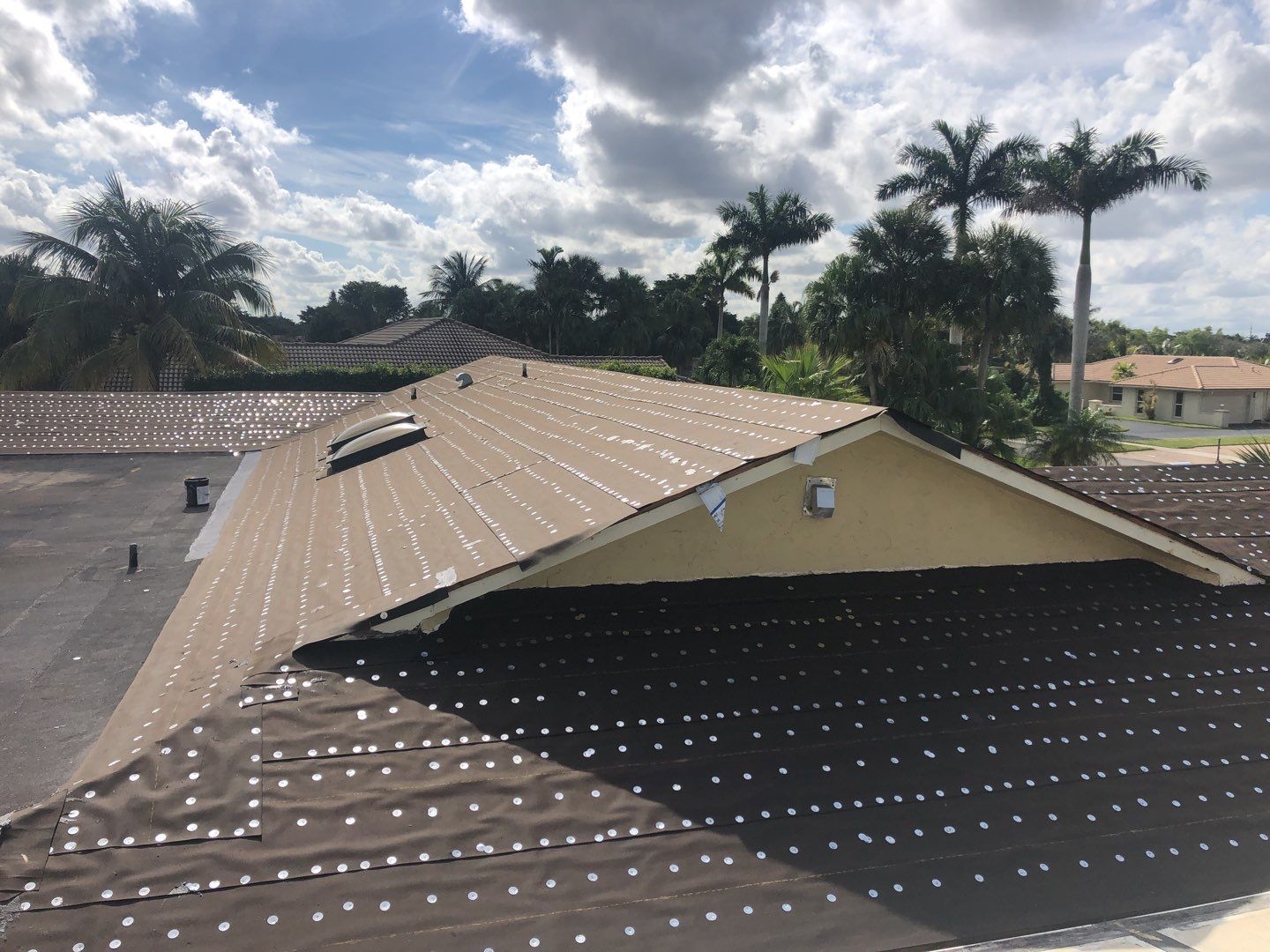 Residential Roofing Installation using 1" Nail strip metal roof by BLUES BROTHERS ROOFING