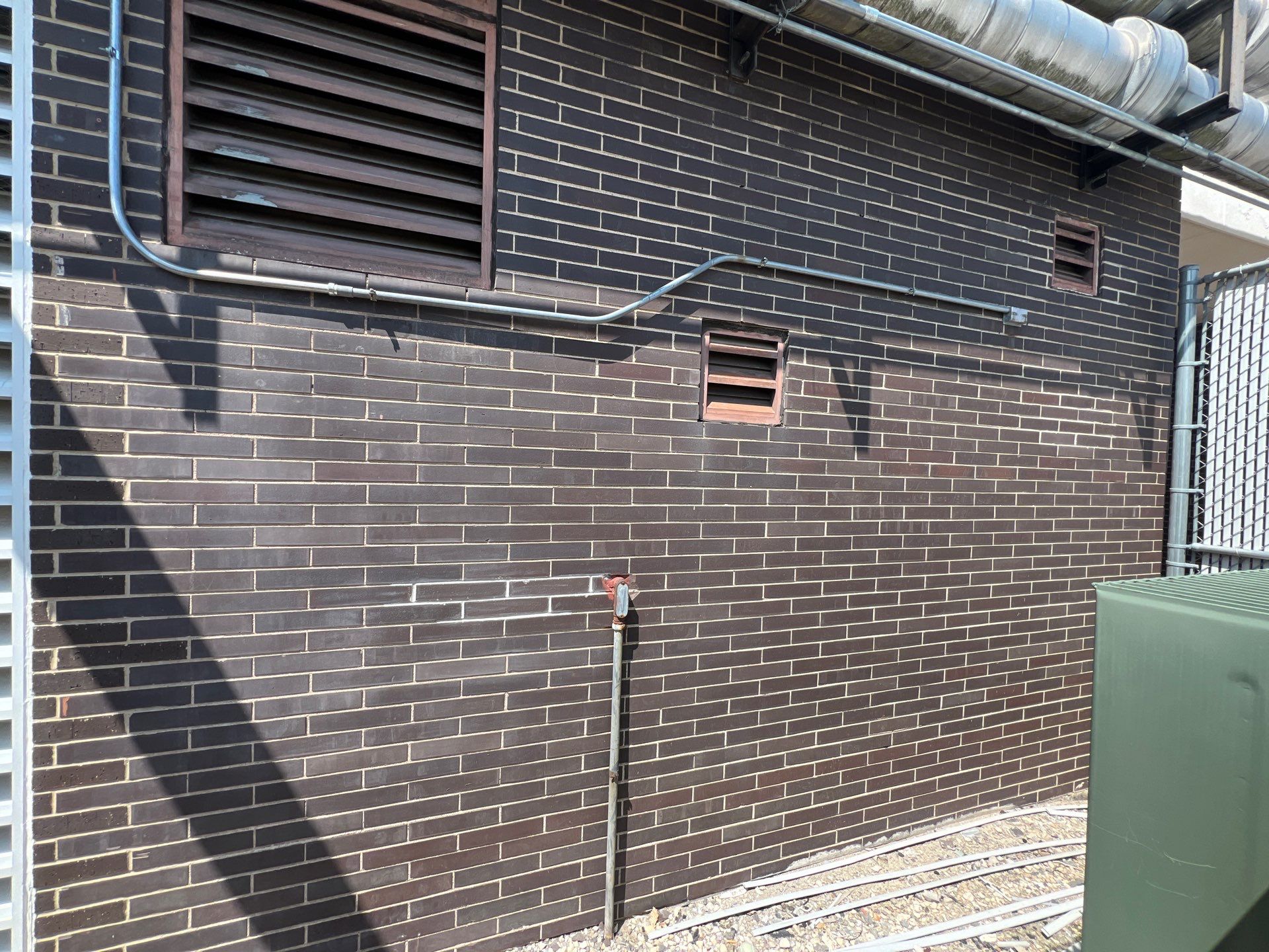 commercial pressure washing using Algaecide, soft wash soap by Northern Power Washing LLC.