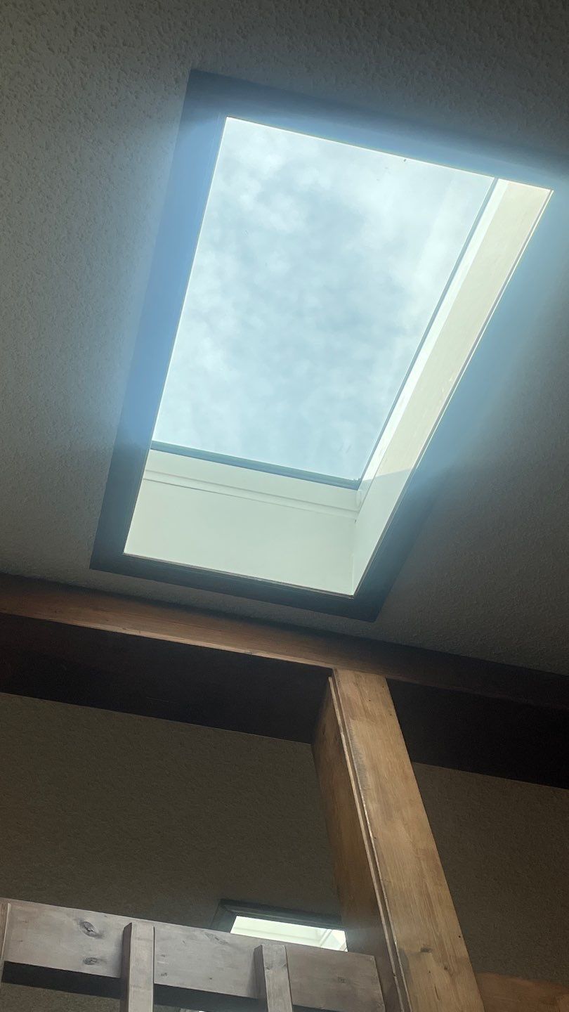 Shingle Roofing with Velux Skylight replacement and stone chimney flashing  by Secure Construction Company Inc