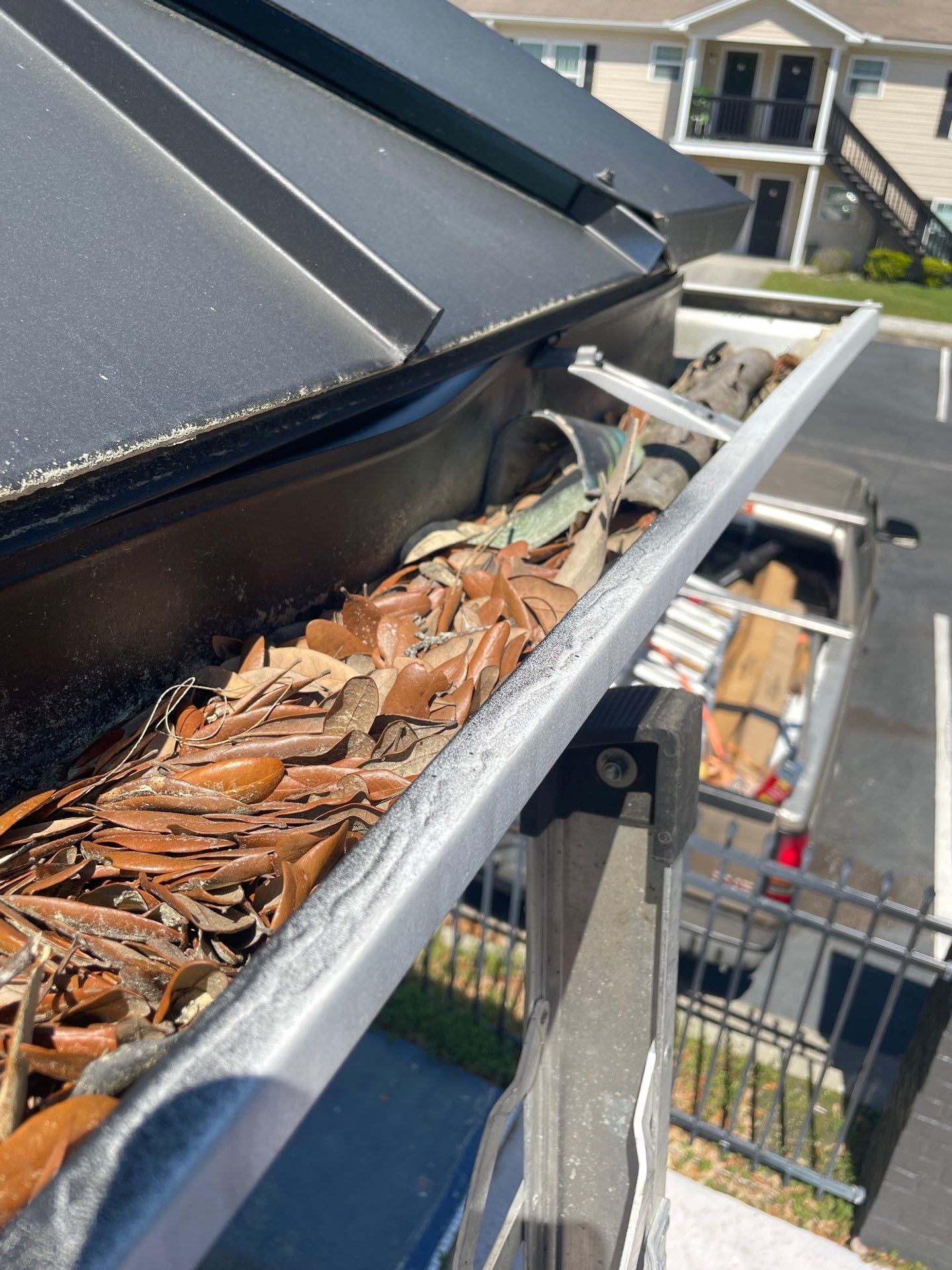 Commercial gutter cleaning Pooler before photo with filled gutters
