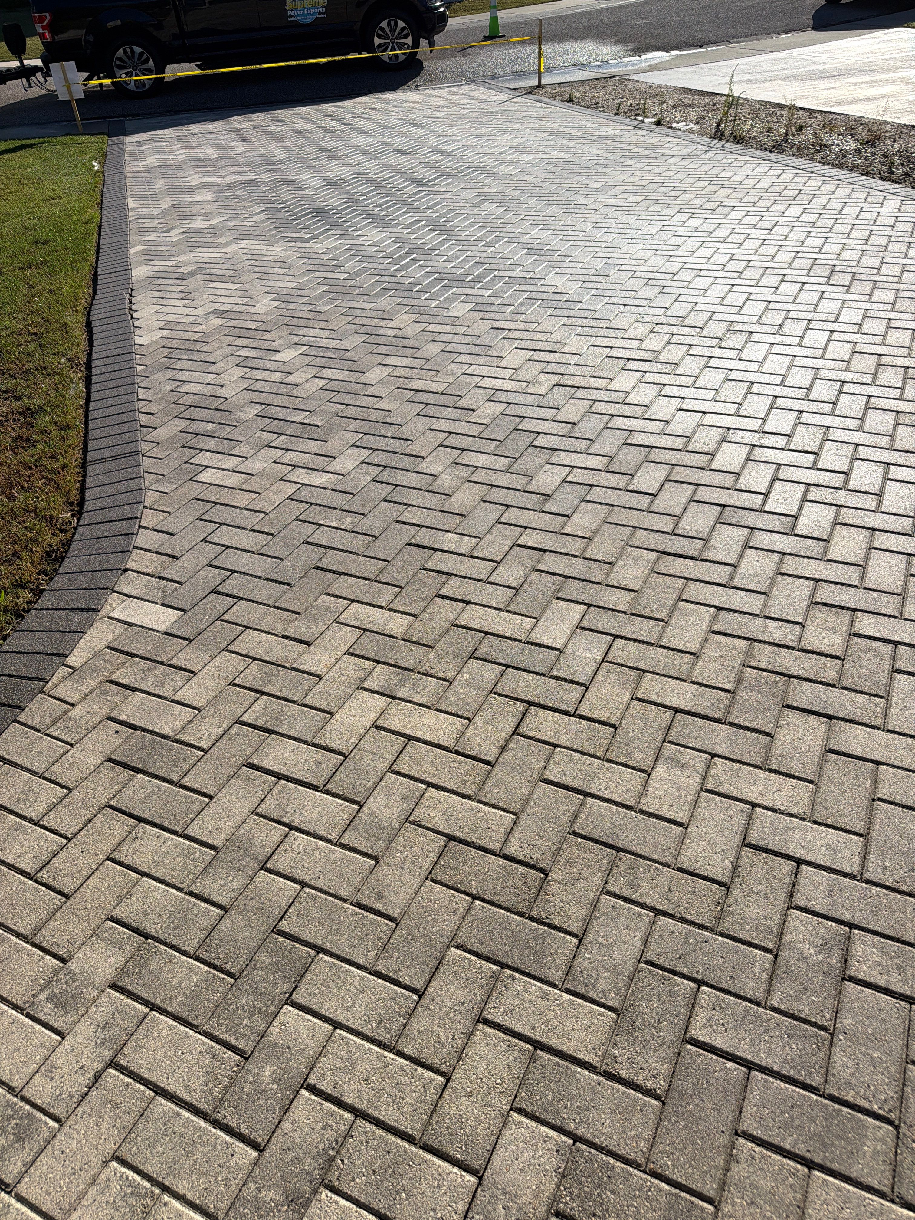 Paver Sealing and Cleaning for Herringbone Driveway in Sun City Center by Supreme Paver Experts