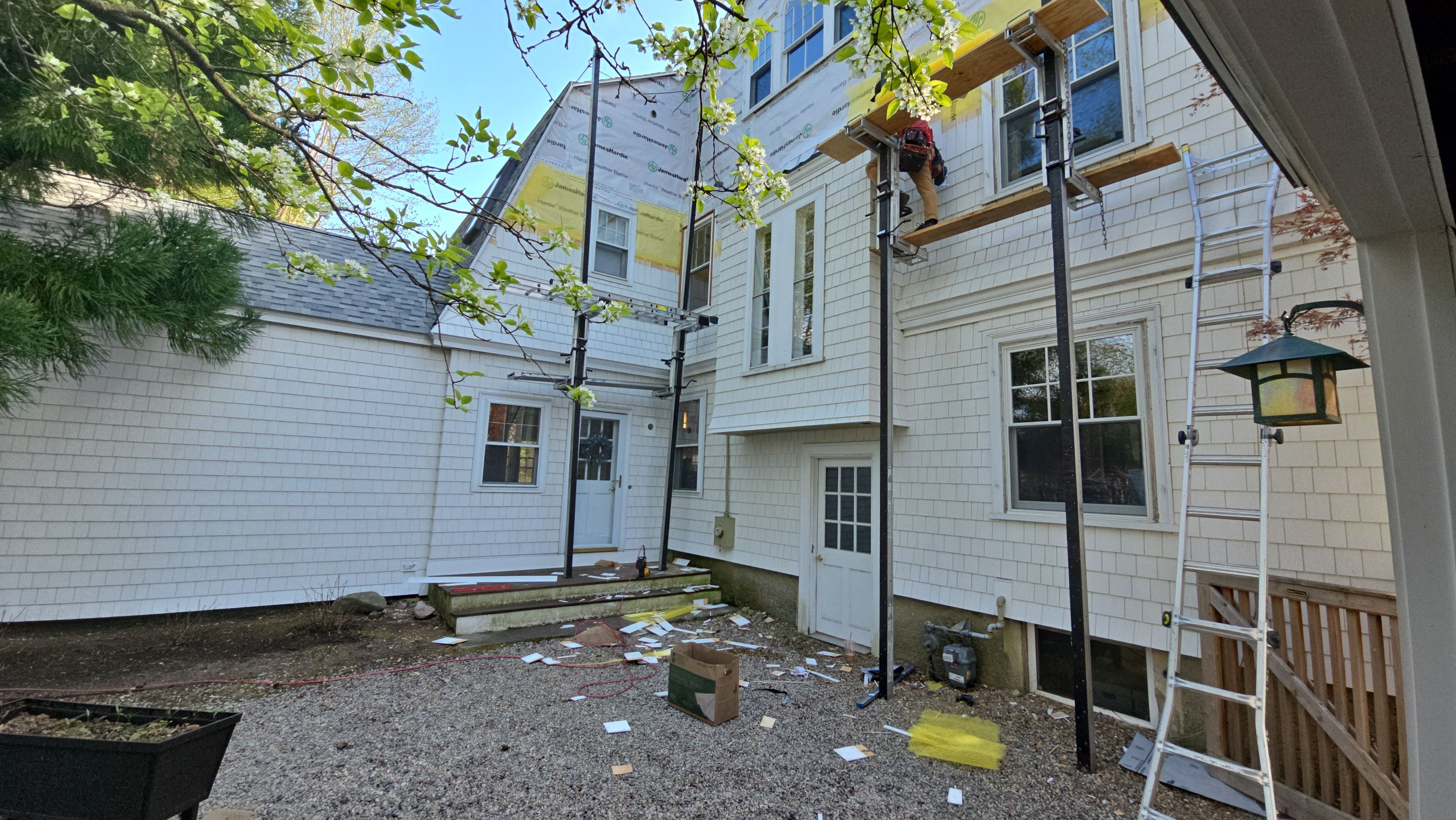 White cedar shingles and windows in Wayland, MA by UBrothers Construction