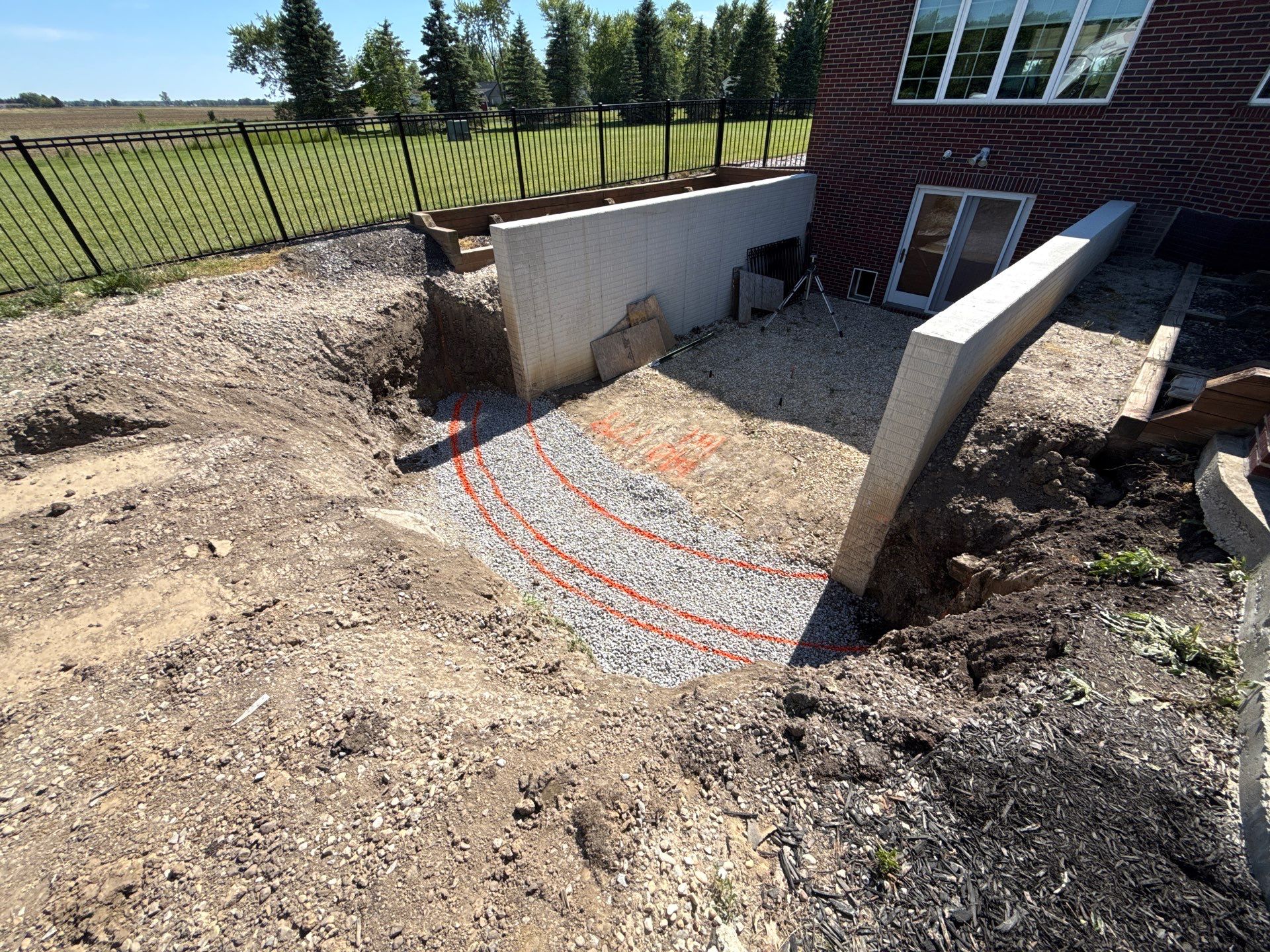 Basement Walkout Construction with Tiered Retaining Walls in Berkey by Farrell's Lawn & Garden Center LLC