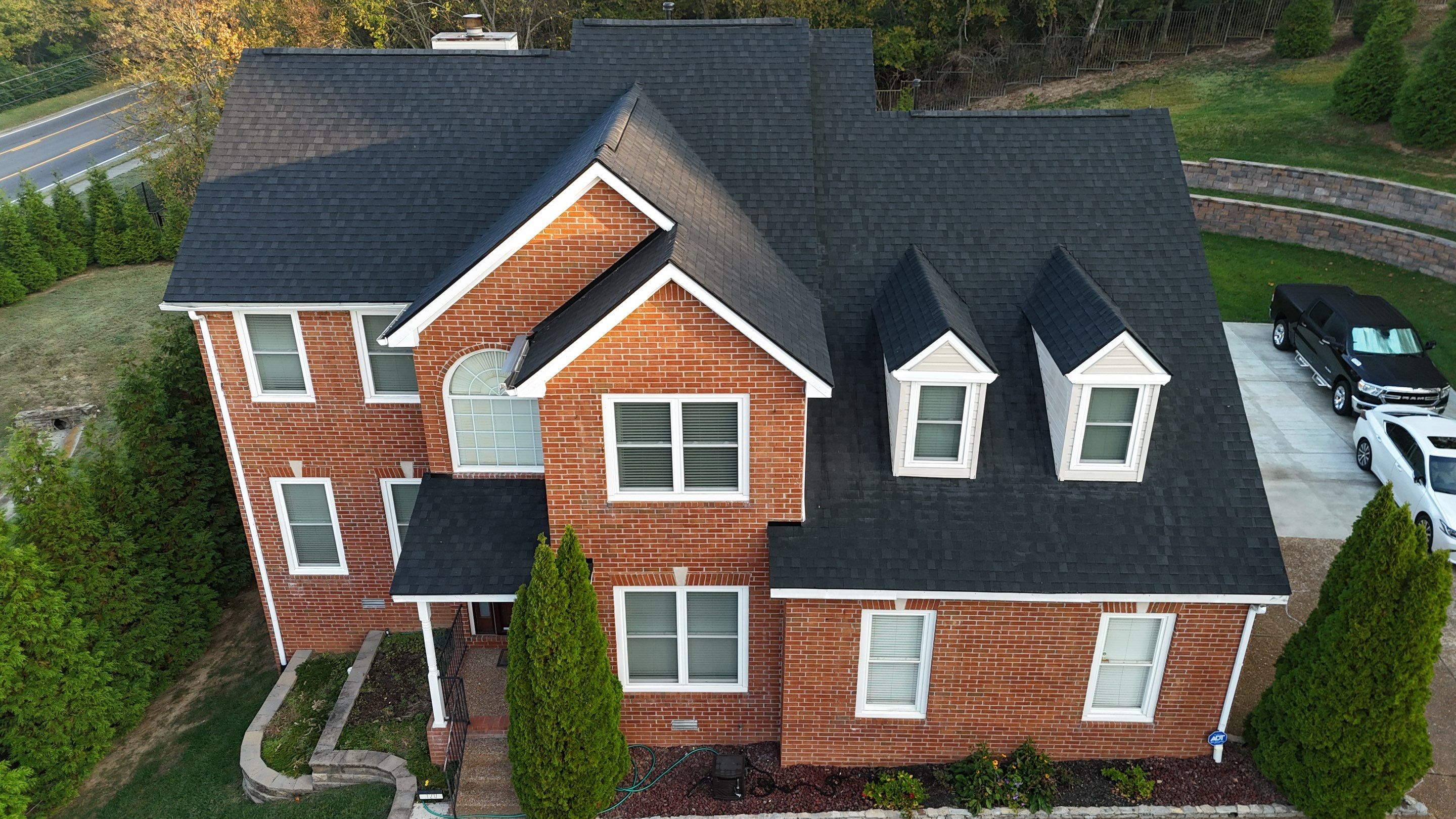 Charcoal Black Re-Roof & Gutters by Royal House LLC