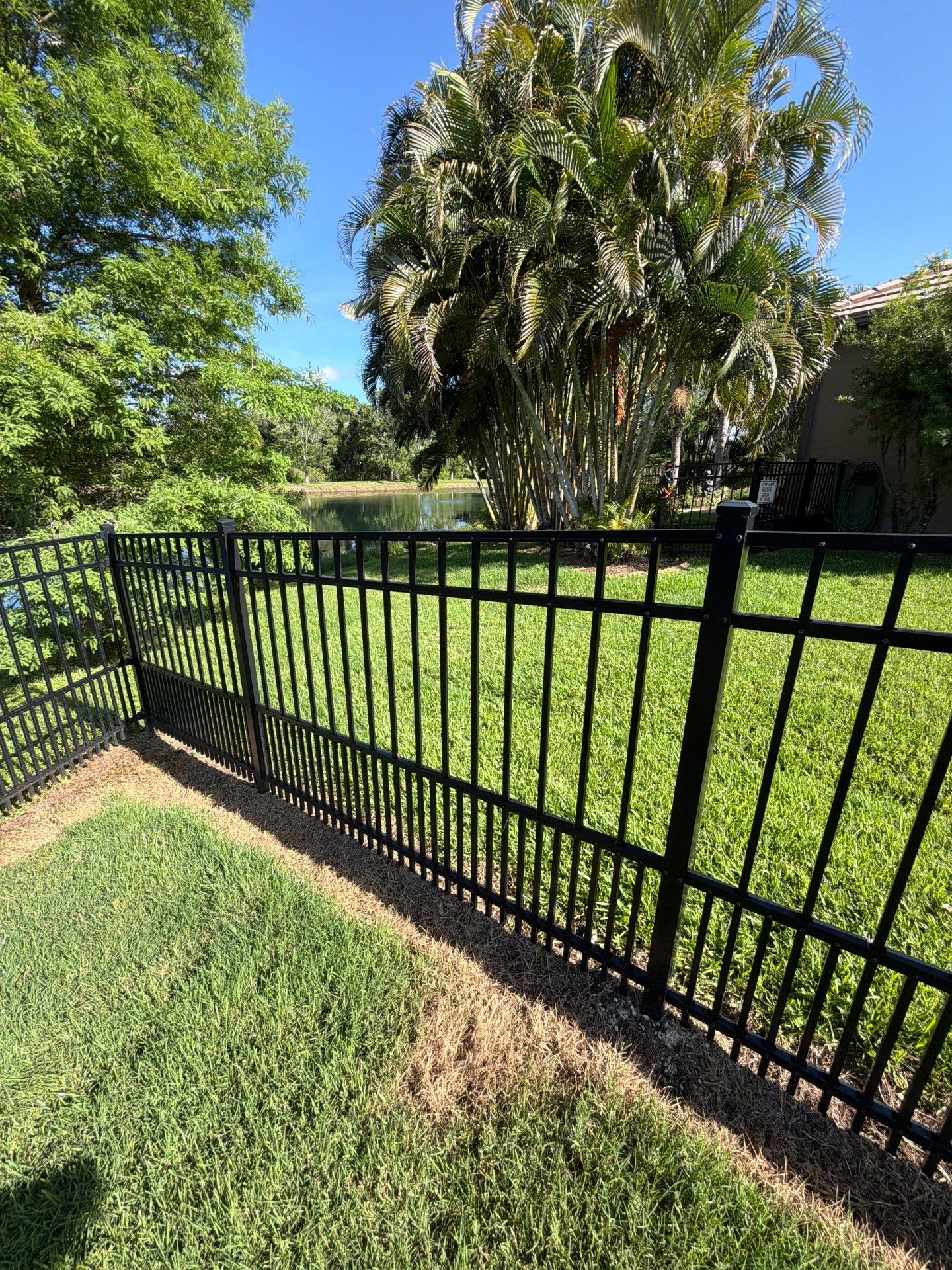 customer with puppy picket aluminum  by H&Y Fence
