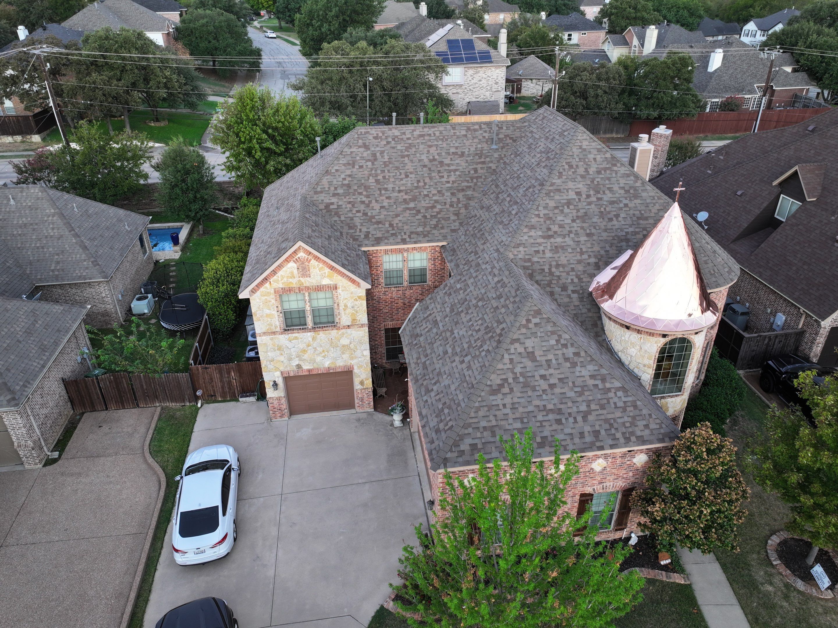 Installing Custom copper turret and Malarkey Vista Class 4 shingles Hail Damage Upgrade by Becker Roofing and Exteriors