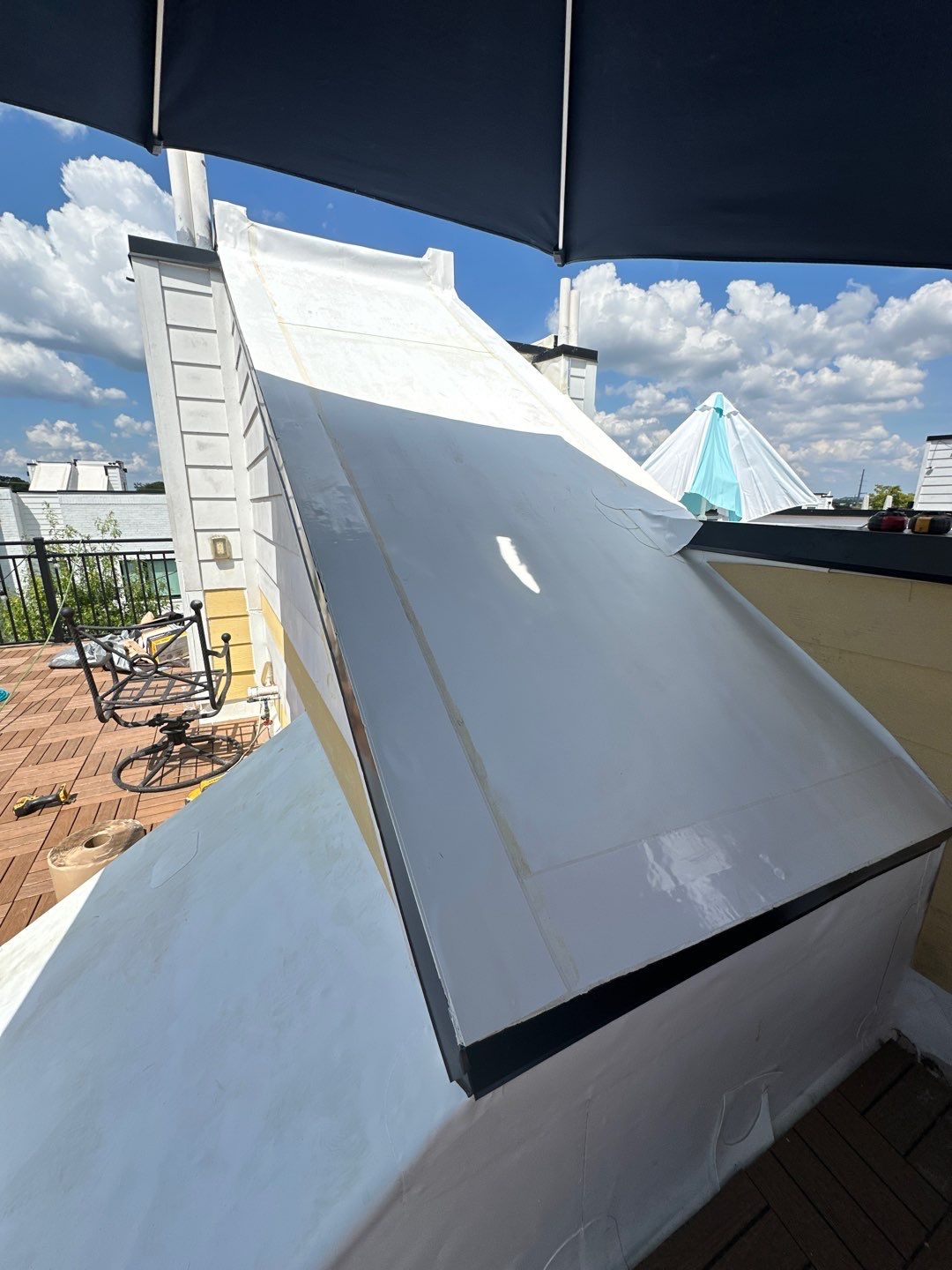 TPO Roofing System with Roof Deck Pavers by Undersun Roofing 