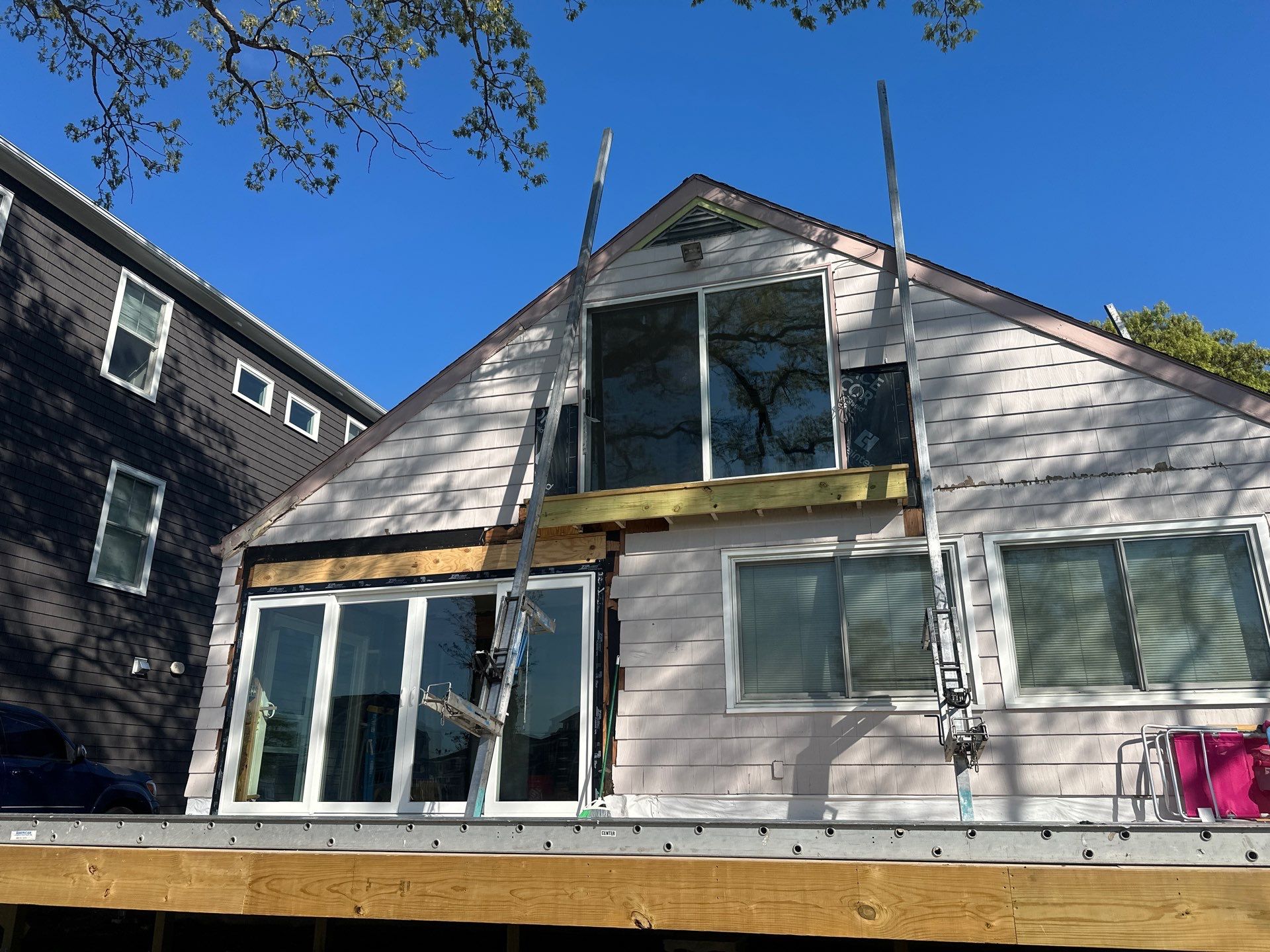 Milford Exterior Renovation Featuring Custom Siding and Wood Deck Installation by A Plus Exterior