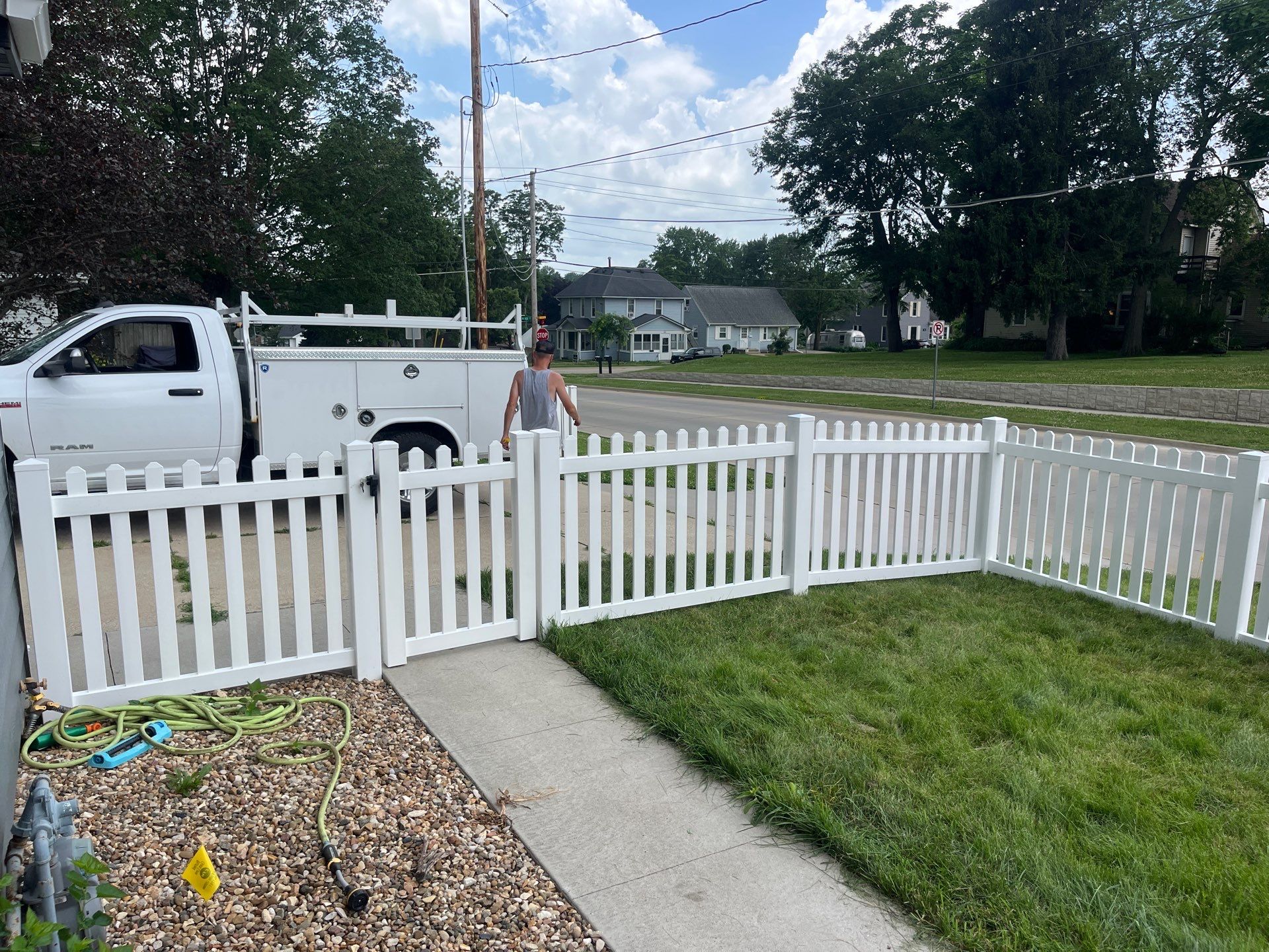 White Vinyl Spaced Picket Fence Installation in Cedar Falls by Perfect Picket Fence and Stain