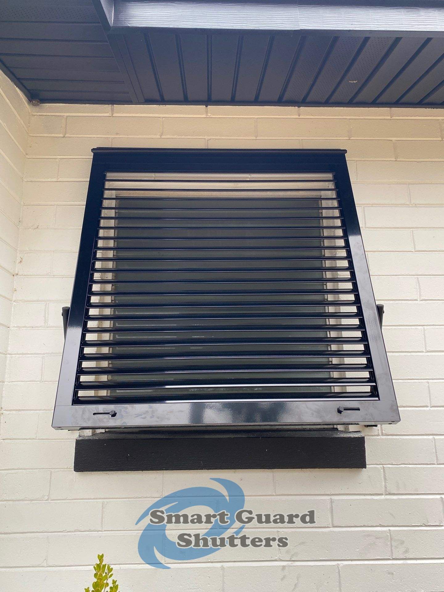 Impact Bahama Shutters in Jet Black by Smart Guard Shutters