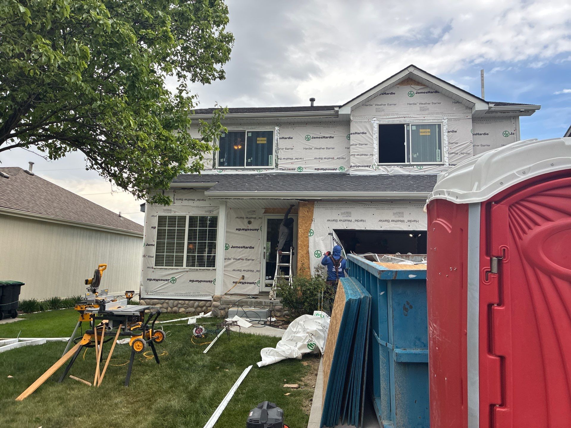 James Hardie Siding and Window Replacement with Arctic White Trim by Carps Complete Exteriors