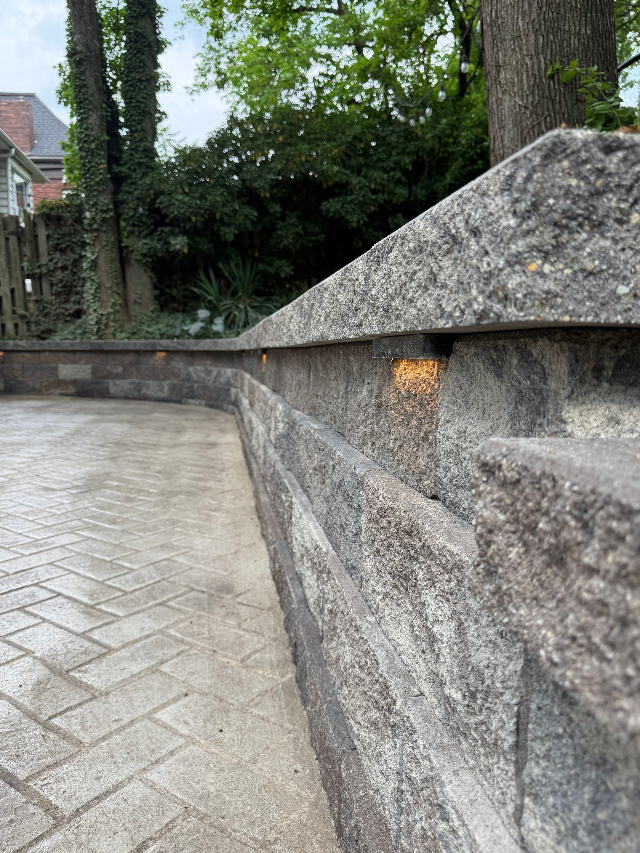 Stamped Concrete and Retaining Wall by Cousins Roofing Siding & Decks