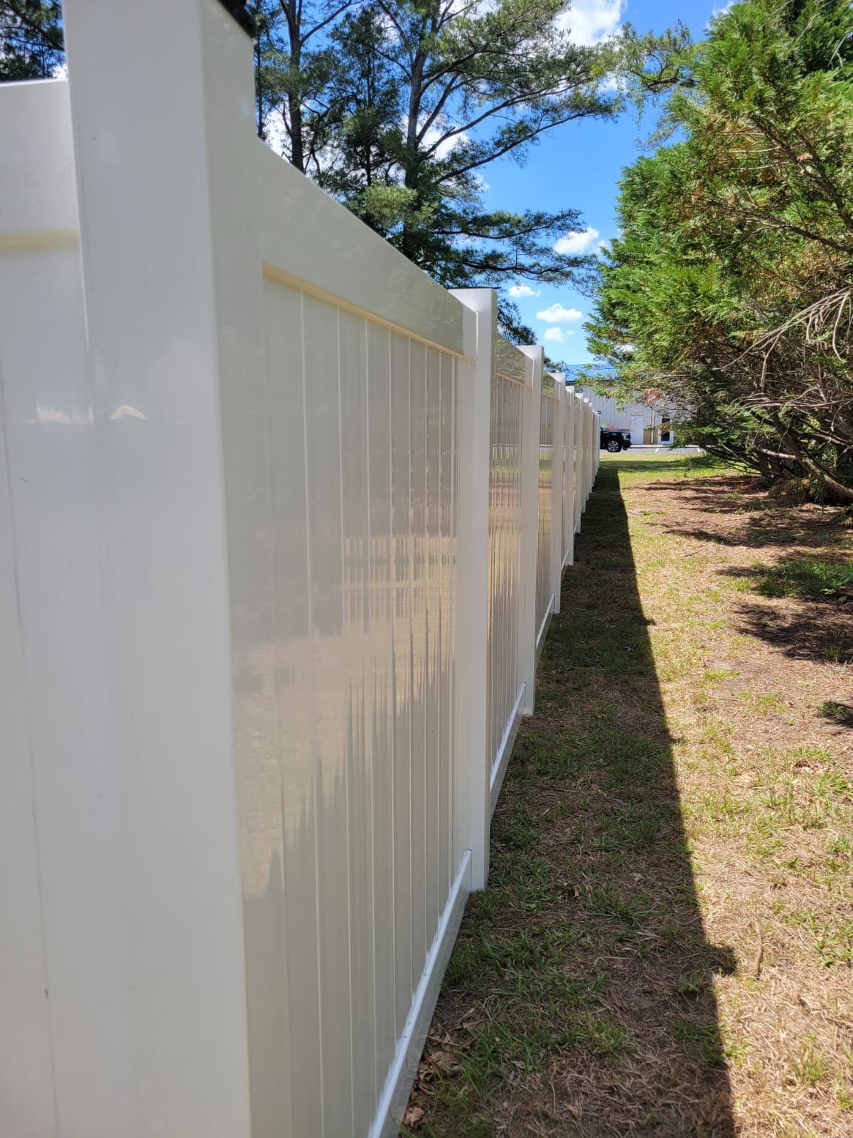 White Vinyl Privacy Fence with Solar Post Caps in Goldsboro by Superior Fence and Rail