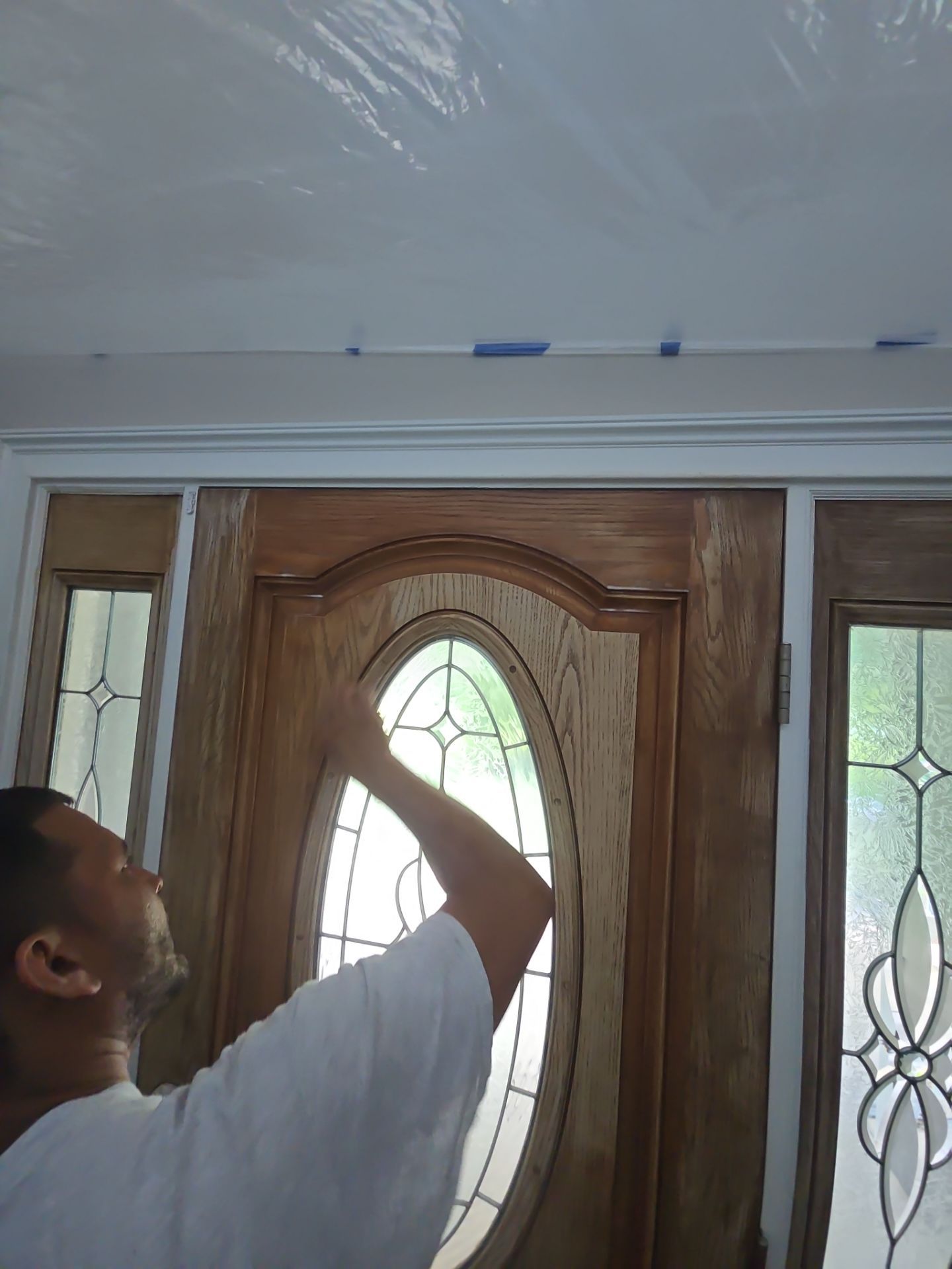 Siding replacement, exterior painting, and front door staining. by GonzalezPainters & Contractors Inc