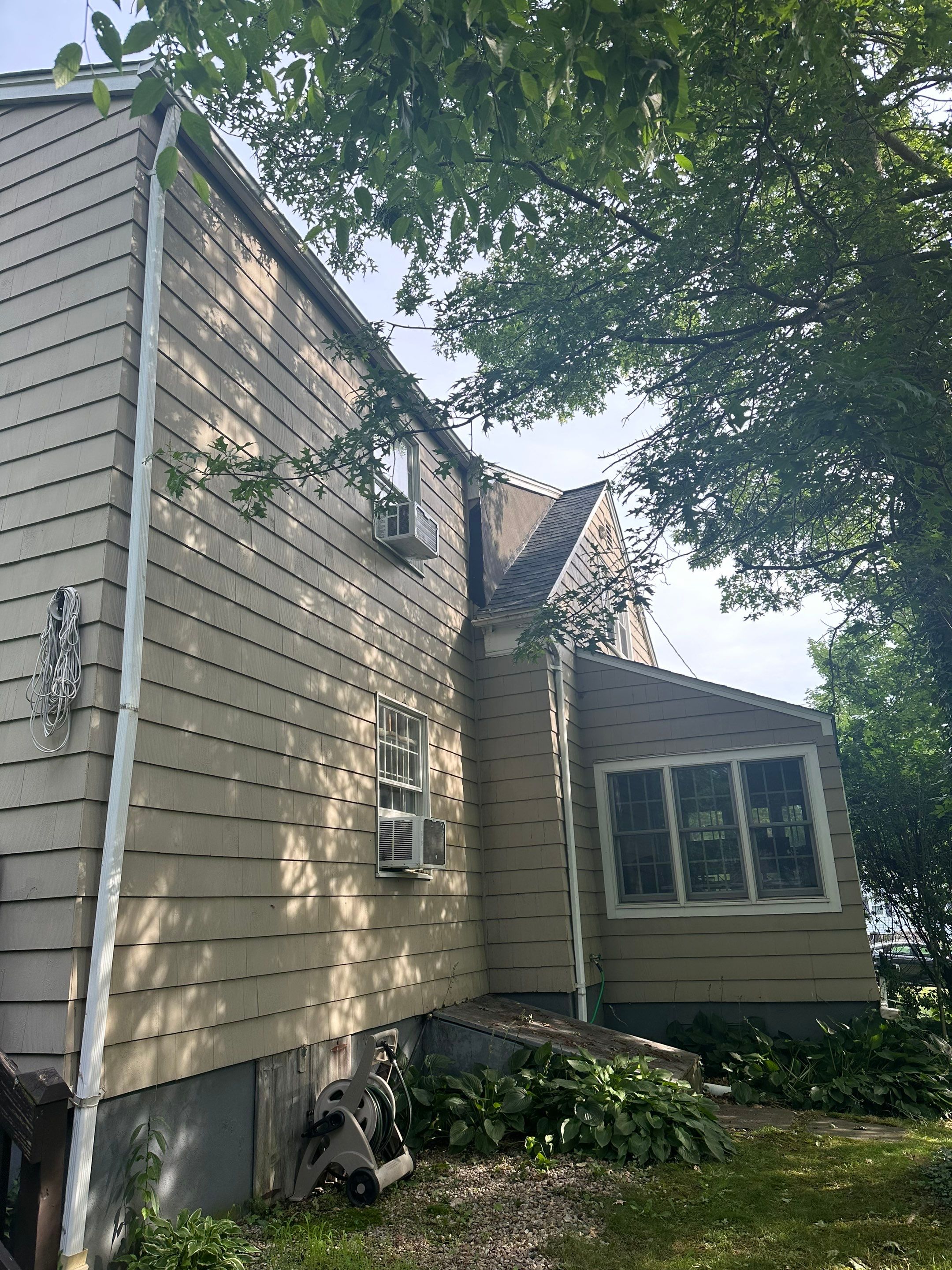 Complete Exterior Estate gray with Pacific Blue Siding by A Plus Exterior