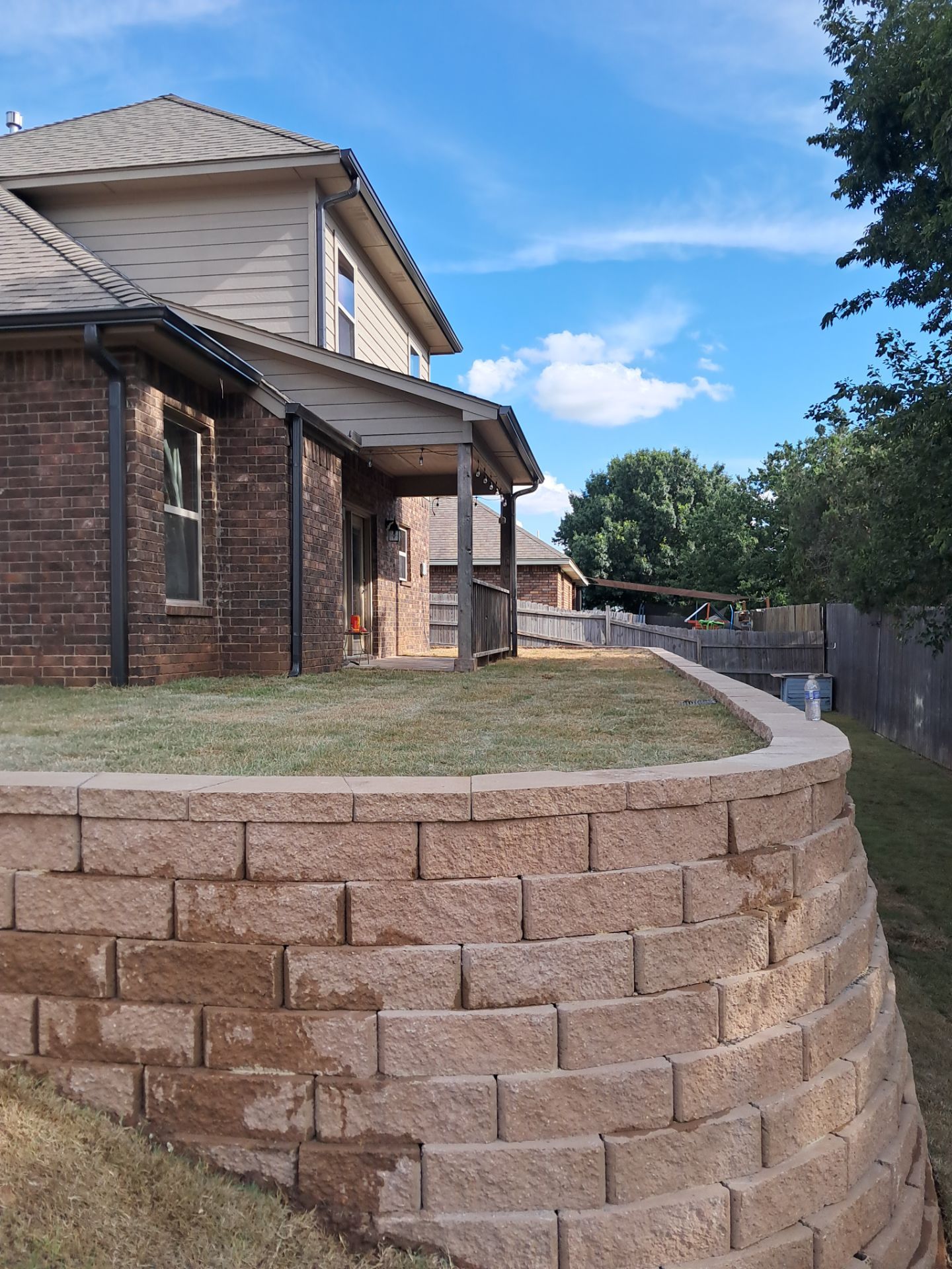 Custom Segmental Block Retaining Wall and Sod Installation in Lawton by Clays Services Inc