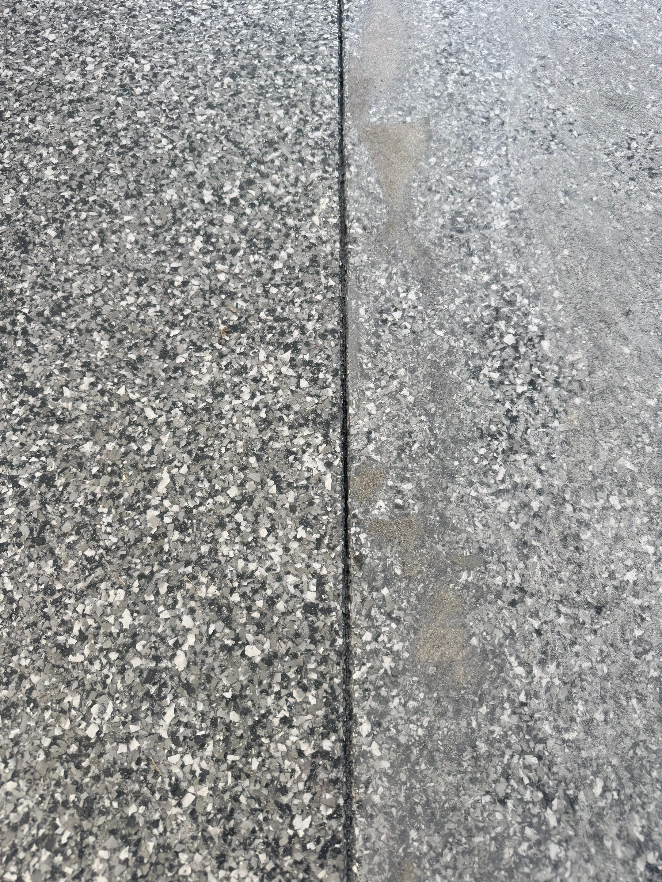 Custom Garage Floor Coating and Backyard Patio Refinishing in Tyndall by Select Painting, Coatings & Garage Cabinets