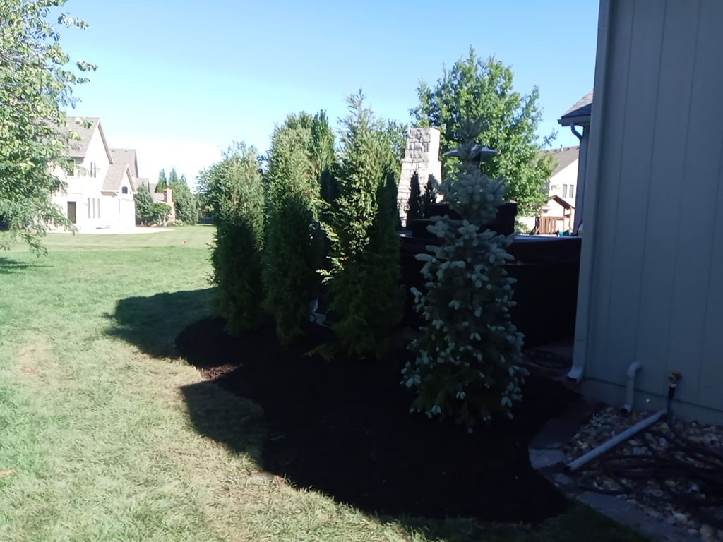 Back Yard Fireplace and Landscape by LAND ESCAPES LLC
