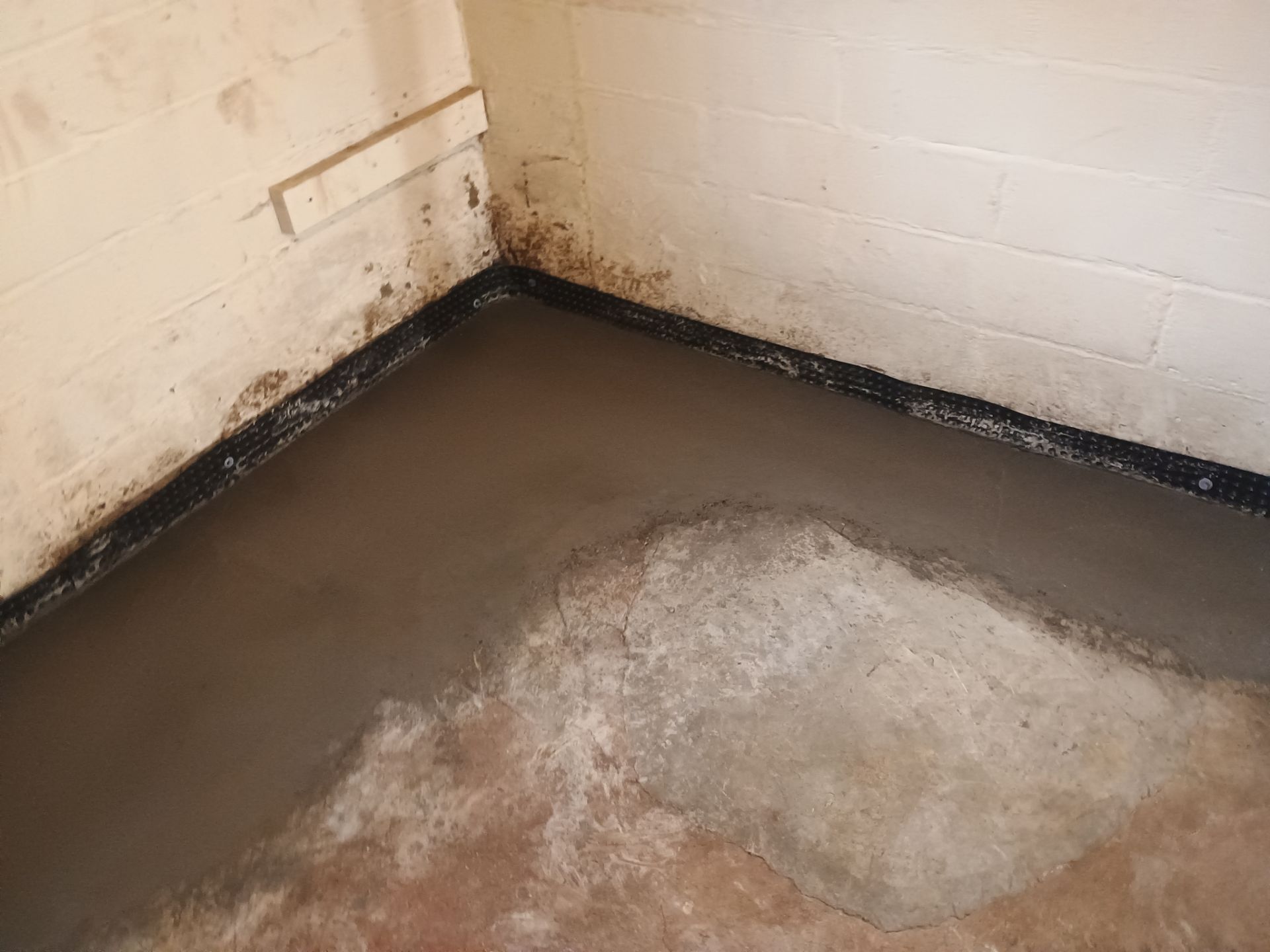 Interior Drain Tile & Sump Pump System in North Minneapolis by Waterproofing Northeast