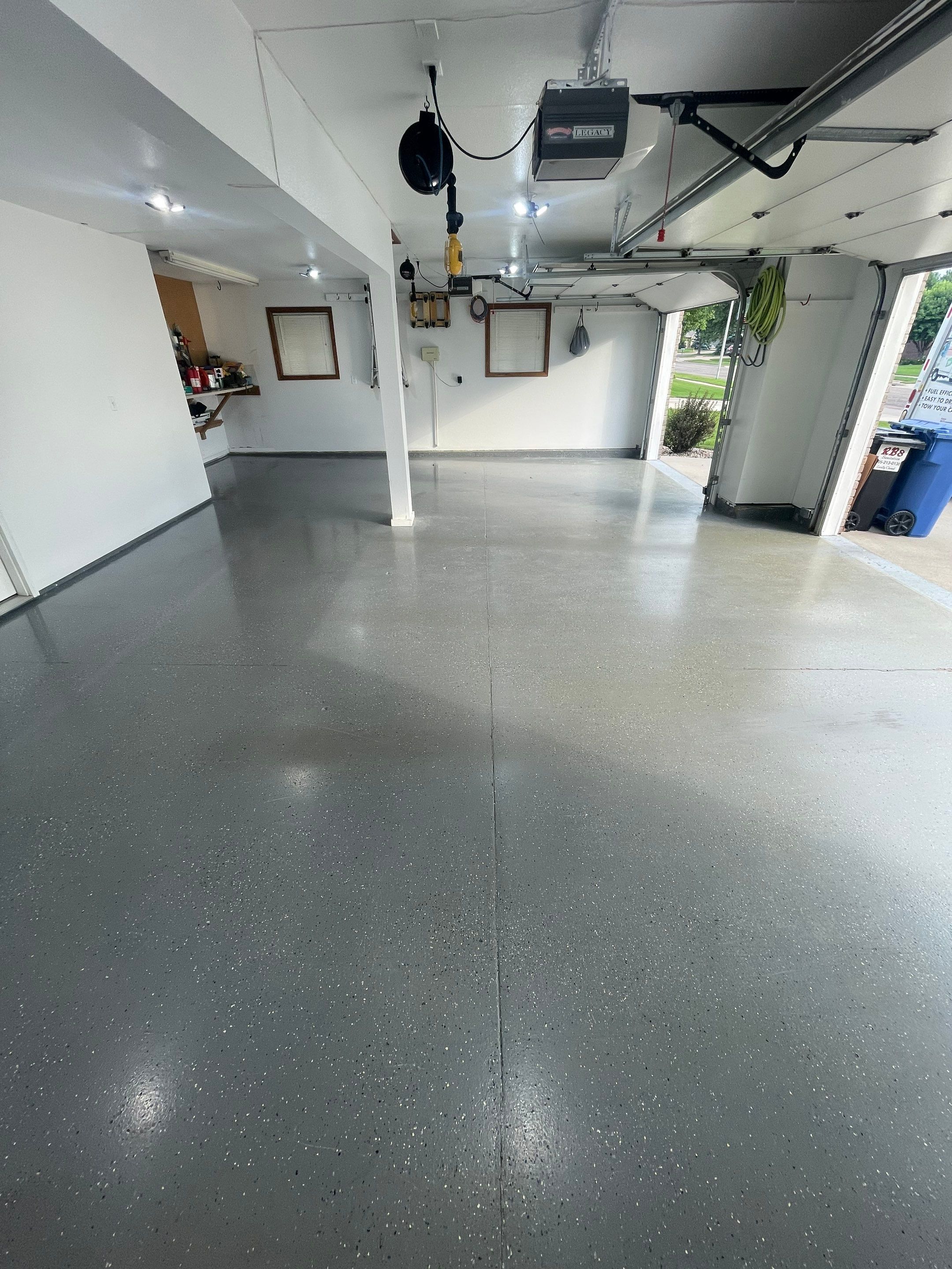 Multi-Car Garage Concrete Coating with Coyote Flake Finish in Sioux Falls by Select Painting, Coatings & Garage Cabinets