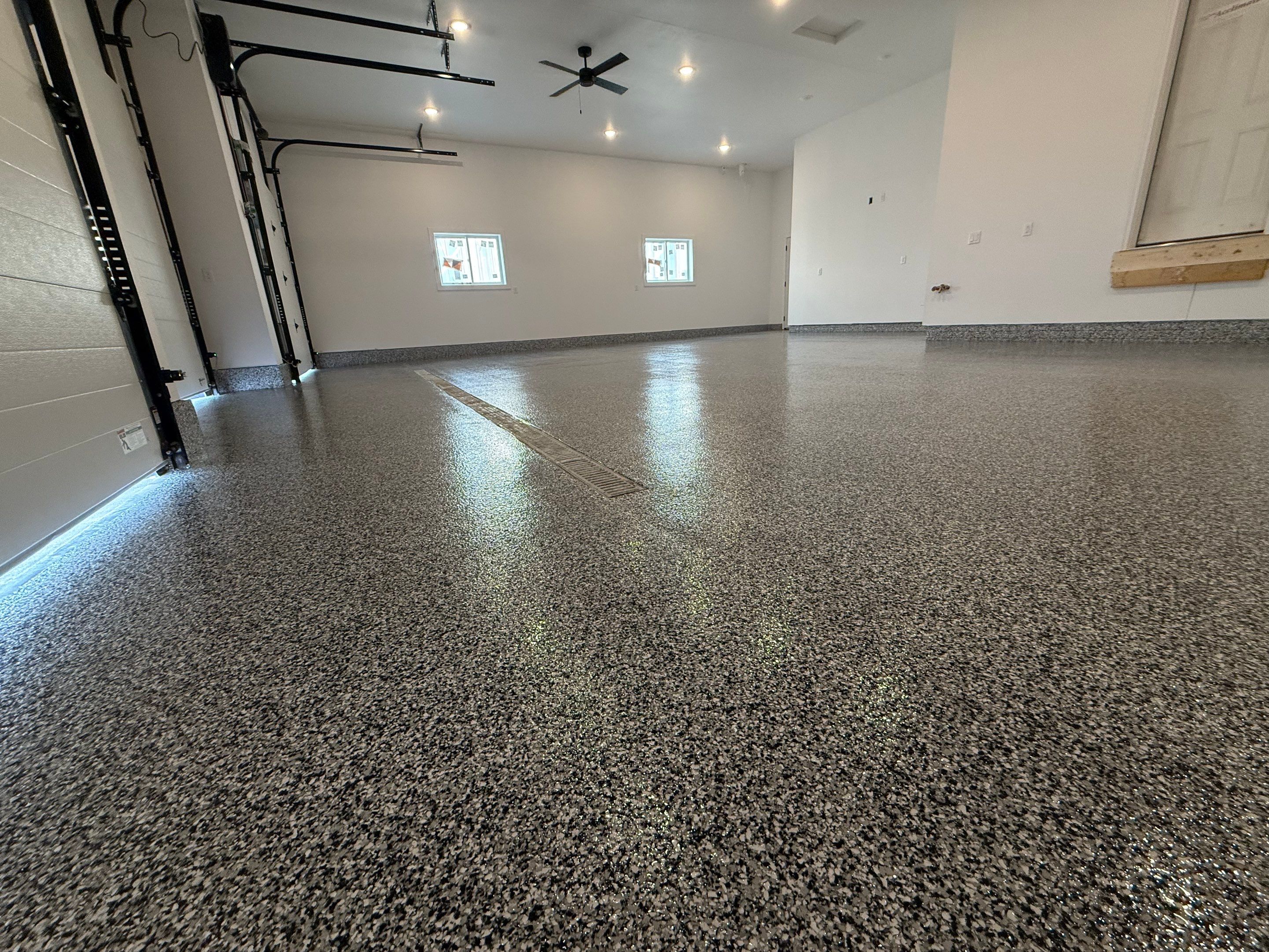 Multi-Car Garage Epoxy Floor Coating and Concrete Finishing in Sioux Falls by Select Painting, Coatings & Garage Cabinets