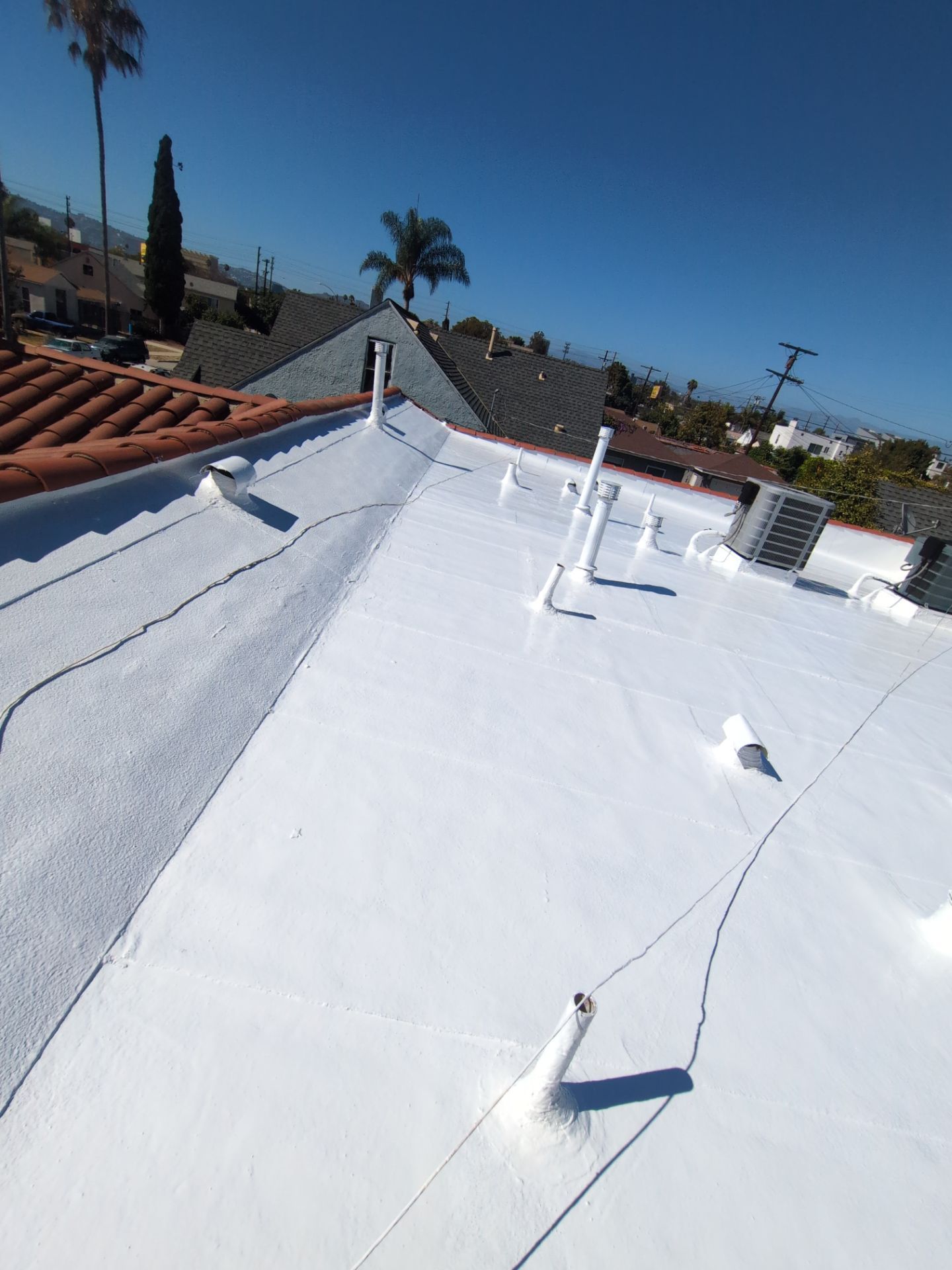 Los Angeles Flat Roof Restoration with White Reflective Coating by Hull Brothers Roofing