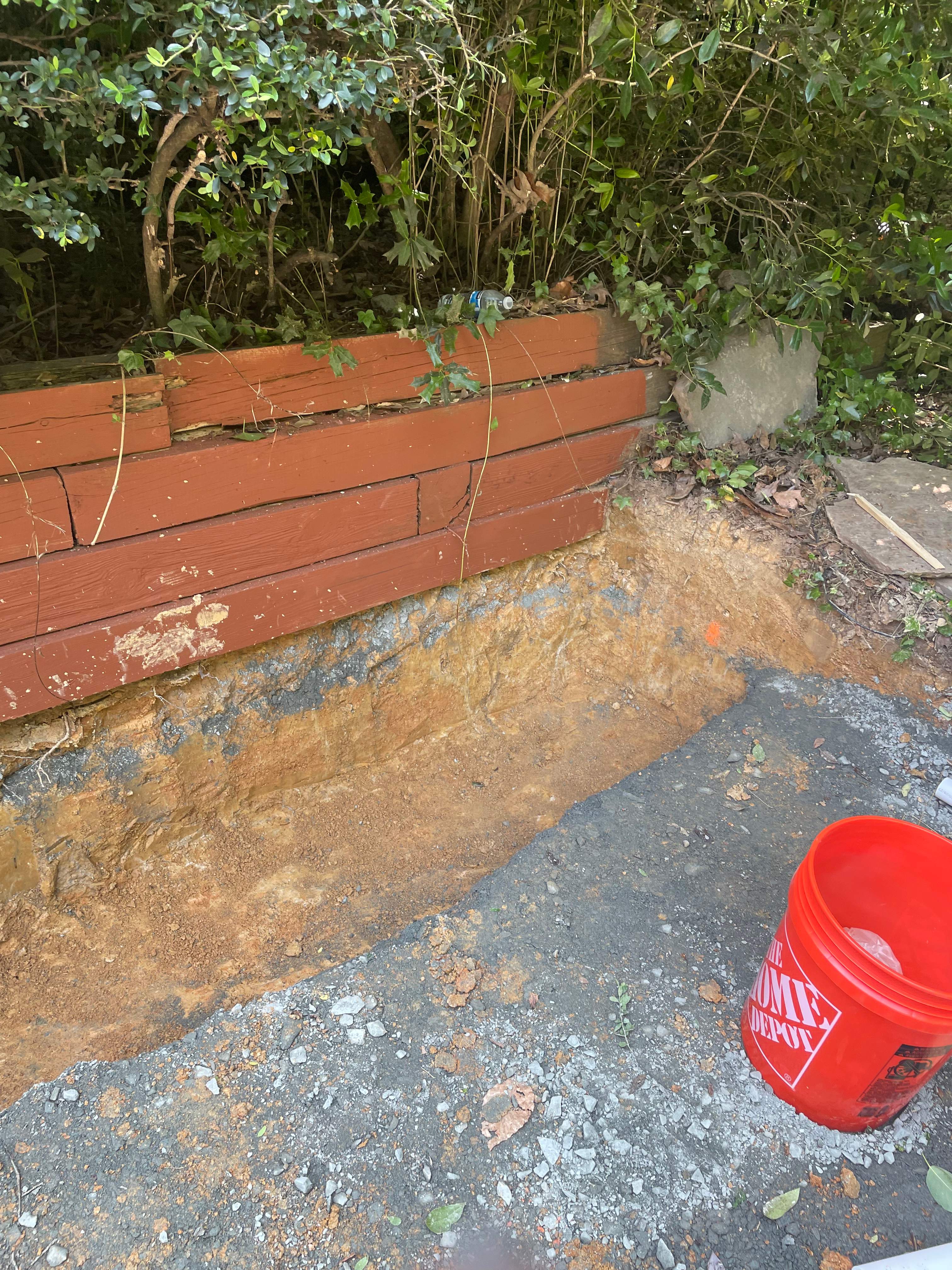 Pool Surround remodel with retaining walls, new waterfall and water slide by Fairfax Contractors, LLC