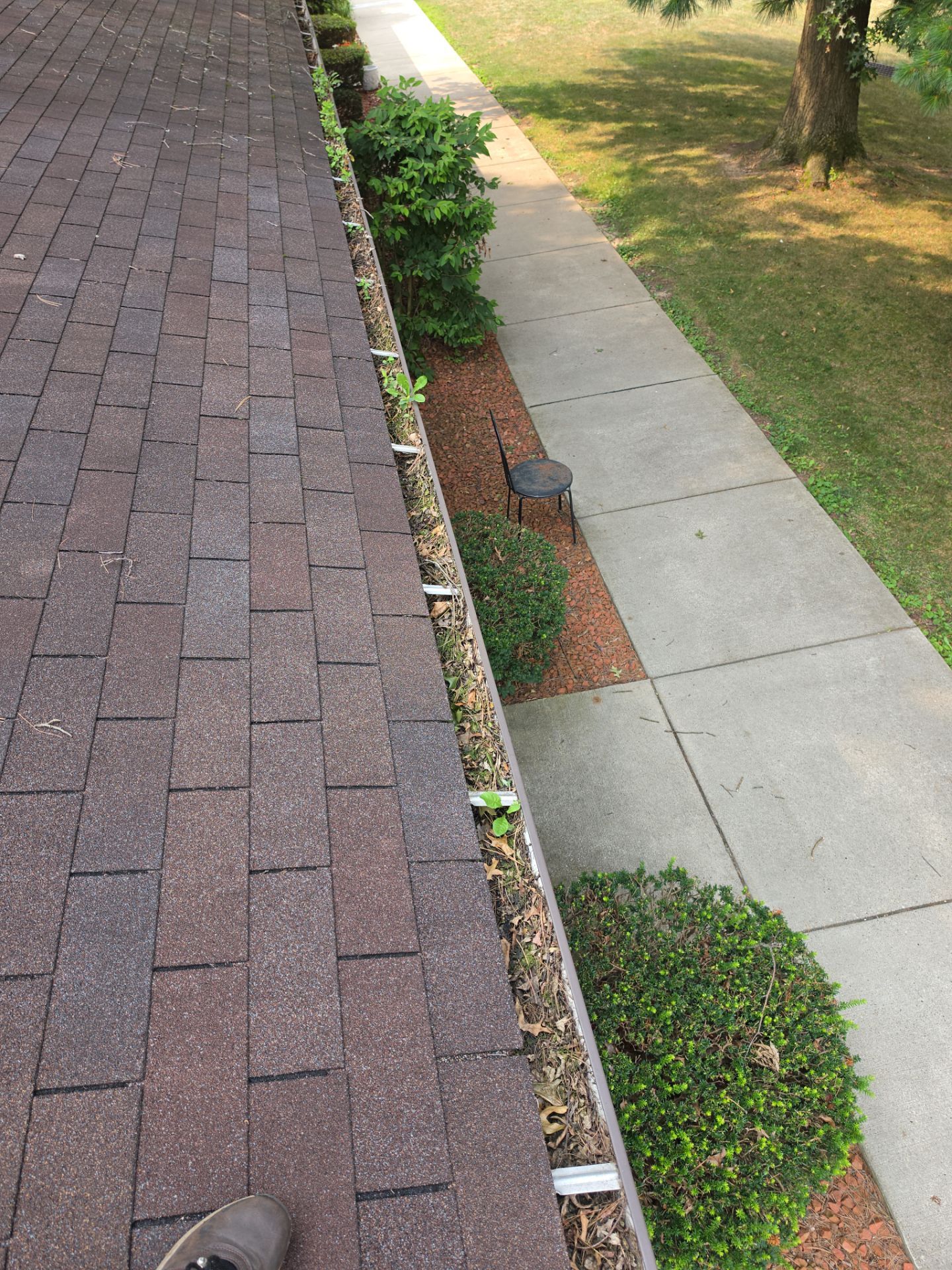 Commercial gutter cleaning Canton, OH before photo with filled gutters