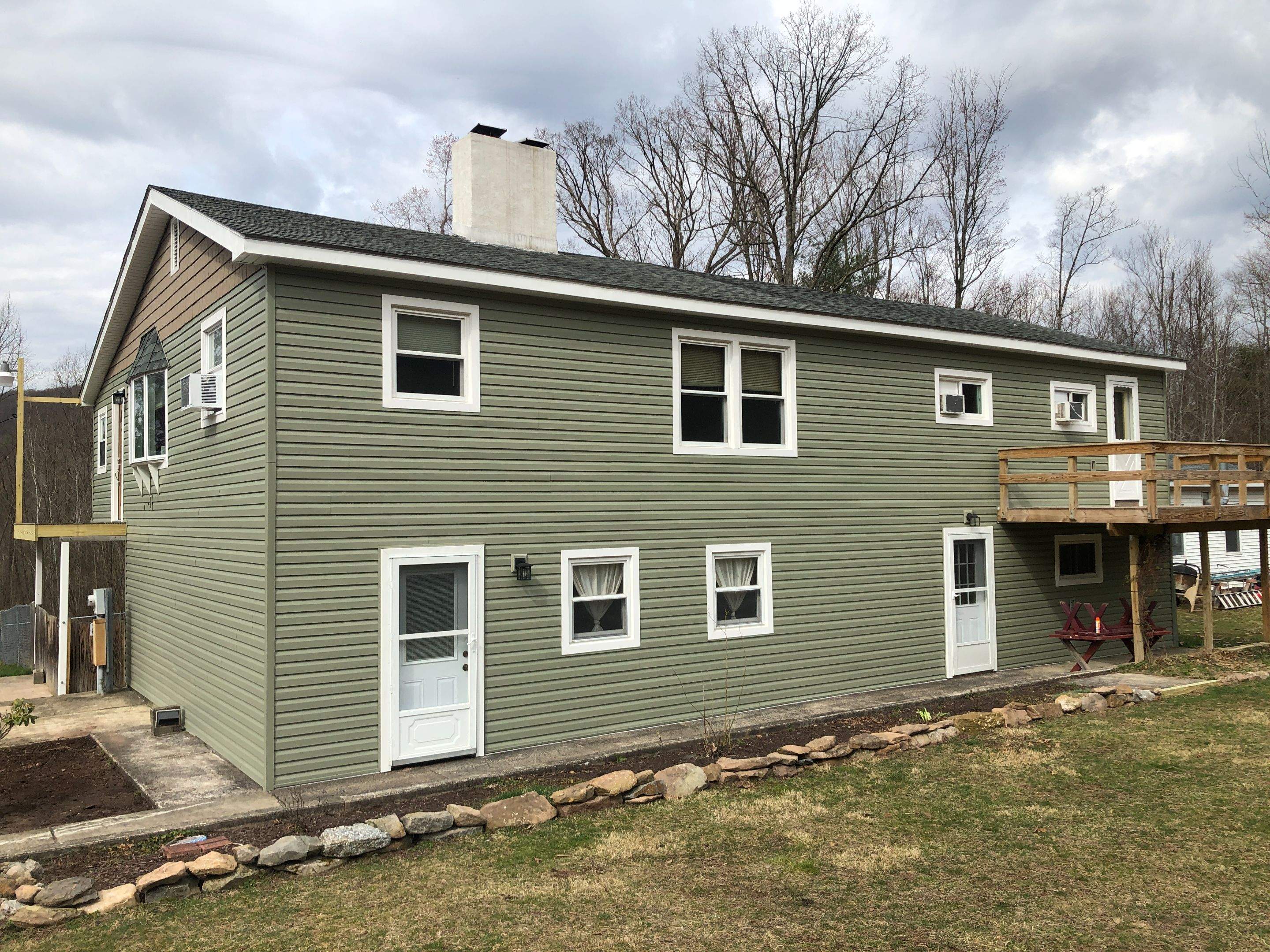 Sage Green Vinyl Siding and Exterior Trim Replacement in Ashland by Esh Builders