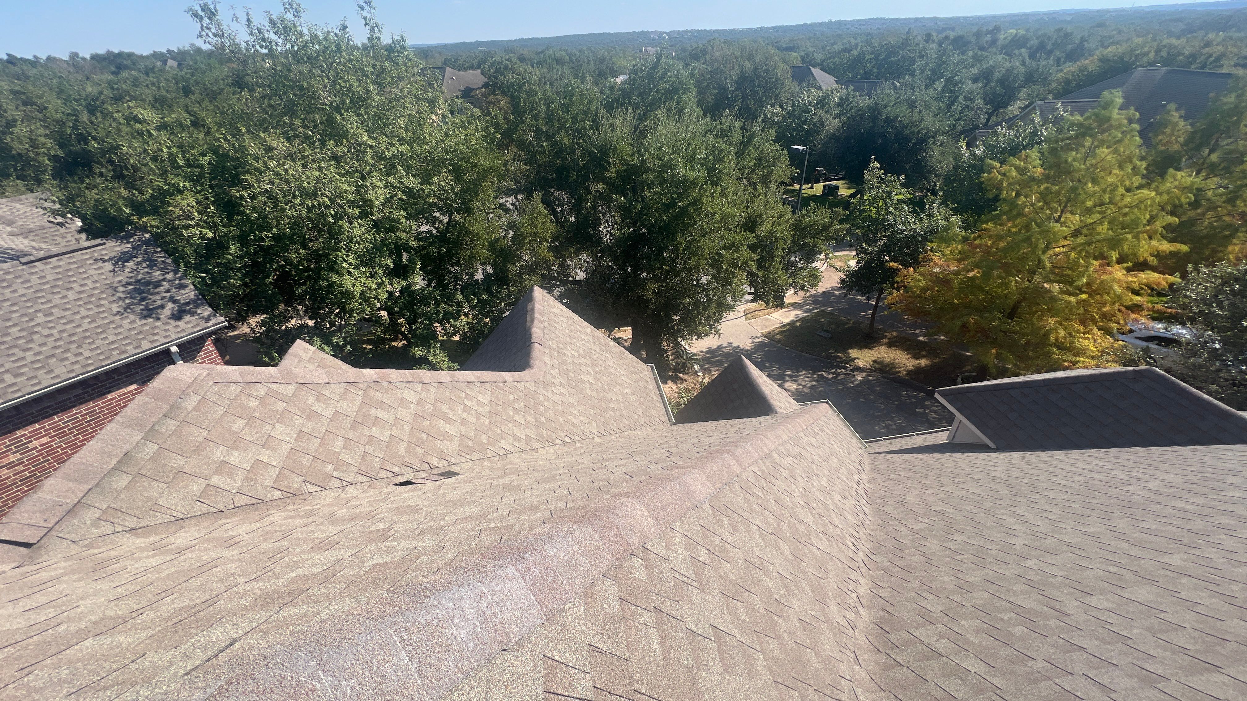 Asphalt Shingle Roof Replacement and Storm Damage Restoration in Austin by Caliber Restoration LLC