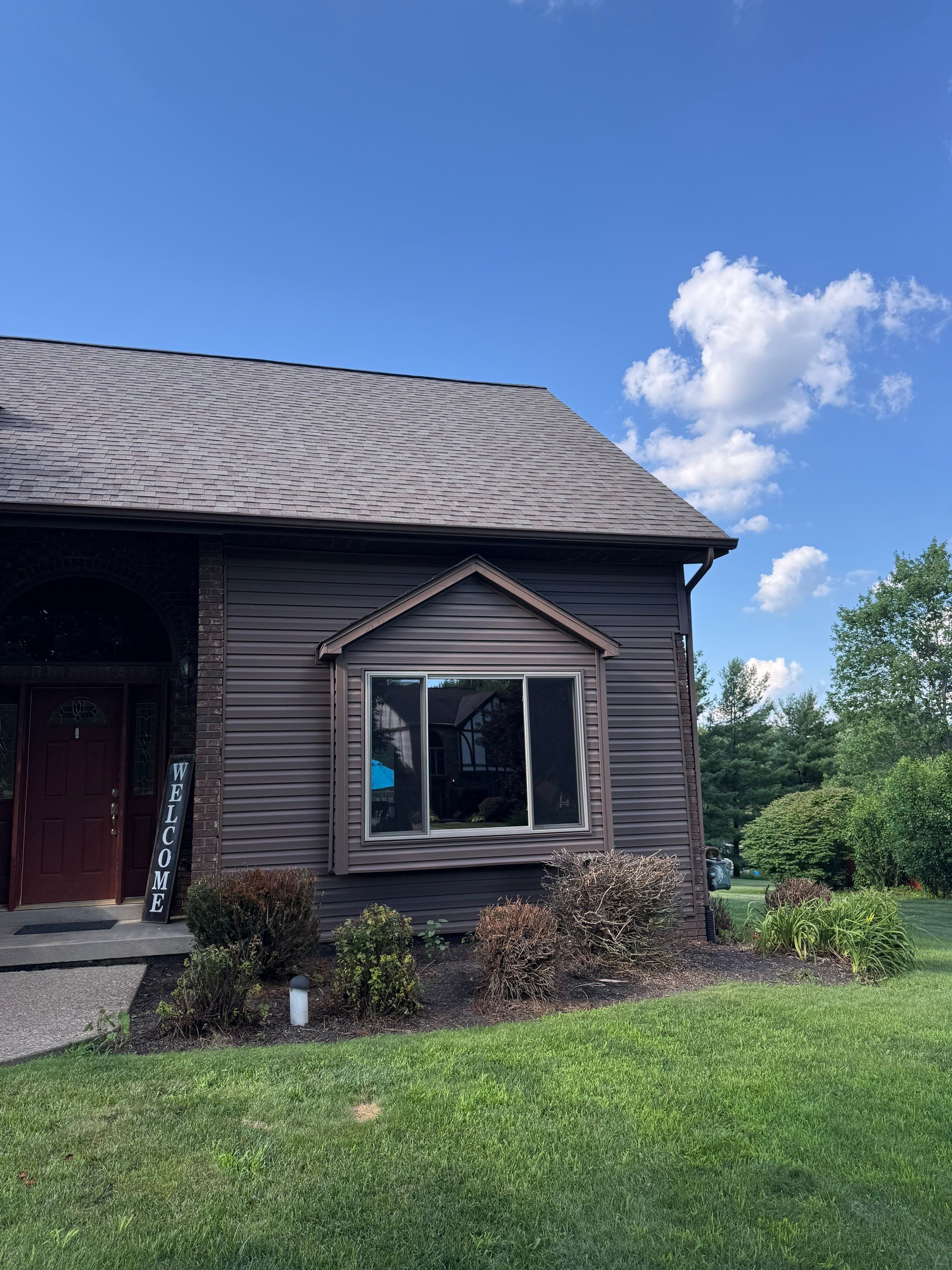 Siding and windows  by Cousins Roofing Siding & Decks