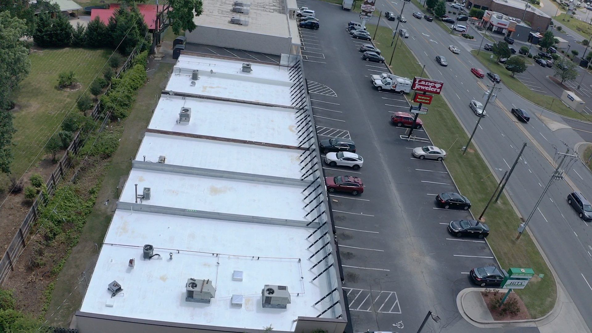 Commercial Roof Coating using Fiberseal basecoat and Silicon Topcoat by Just In Time Roofing and Restoration