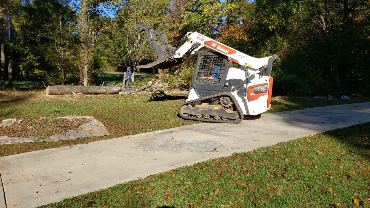 land clearing using machinery by Power Wash Masters LLC